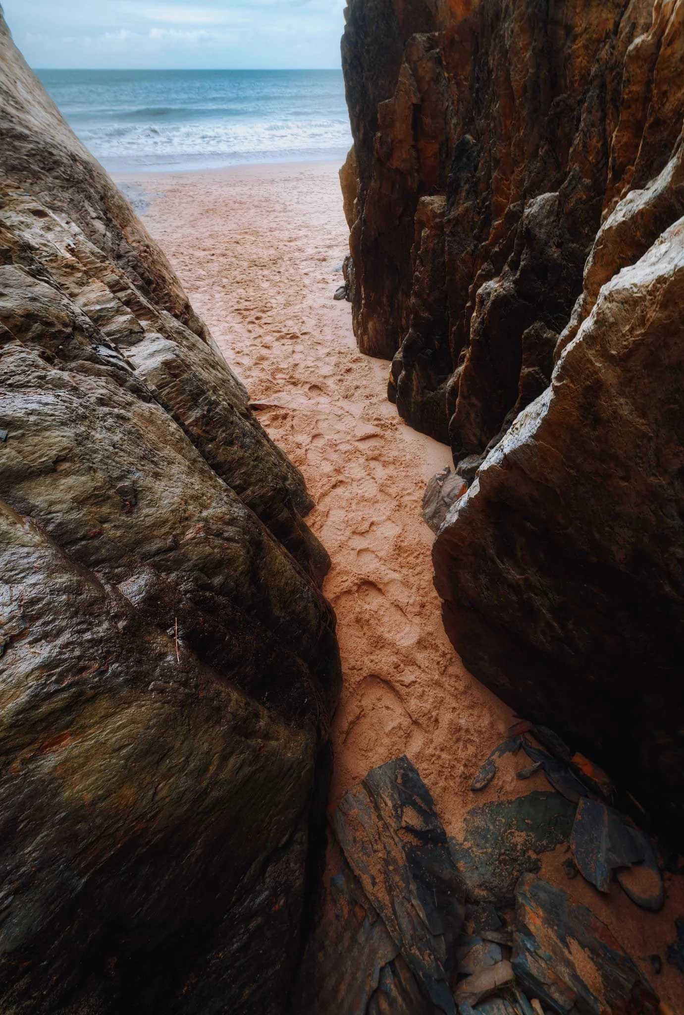  Further down the beach I found this rather deep sea cave that had been carved out by the Irish Sea. I tucked myself deep into the cave as far as I could, then turned back towards the sea and shot multiple exposures for this composition.  
