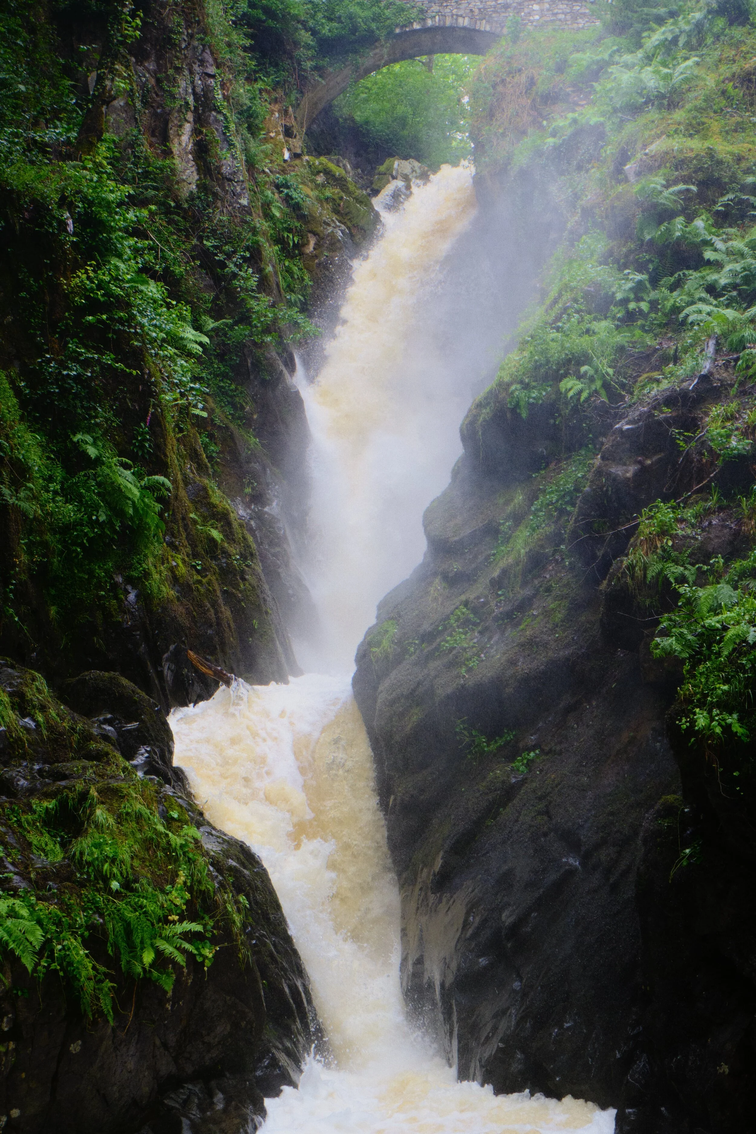  Aira Force, in full spate after a weekend of heavy rain. The waterfall is probably one of the Lake District&rsquo;s most famous, dropping 70ft in two parts with a picturesque packhorse bridge arching above it. 