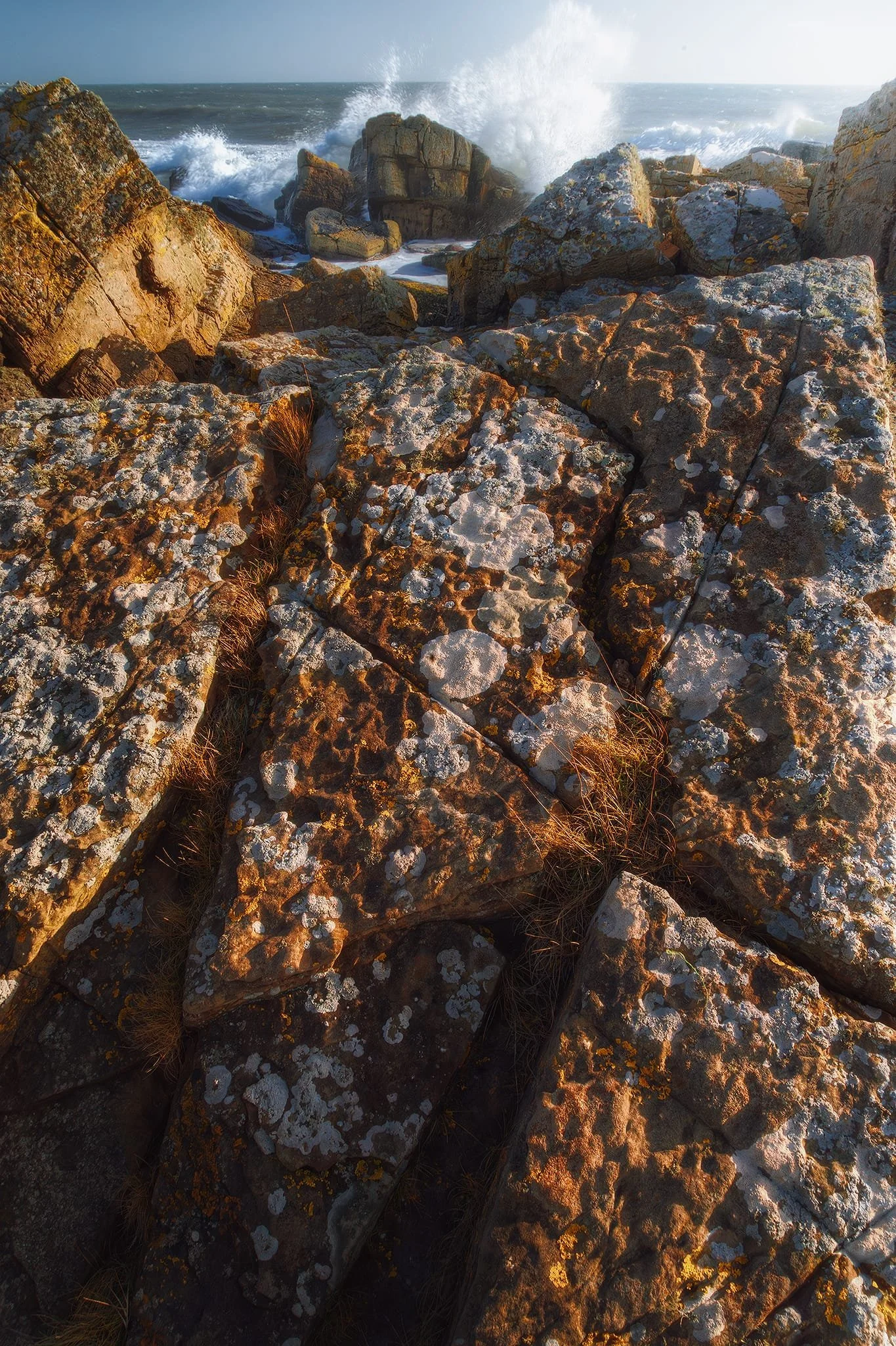  Further along the coast, near the old Salt Pans of Crail, a stretch of massive boulders were being battered by the relentless waves pushed on by the powerful gusts. I clambered all over them looking for compositions and waited for the waves to explode over the boulders. 