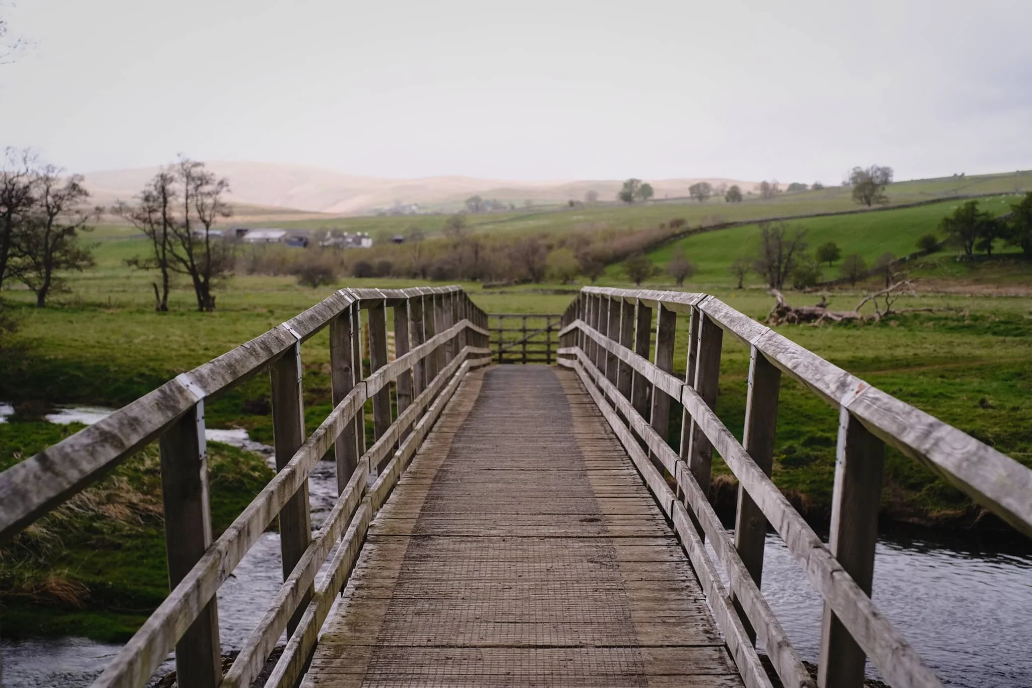  We crossed the River Lowther here, heading vaguely in the direction of Helton. In the far distance are the &ldquo;backends&rdquo; of the eastern Ullswater fells. 