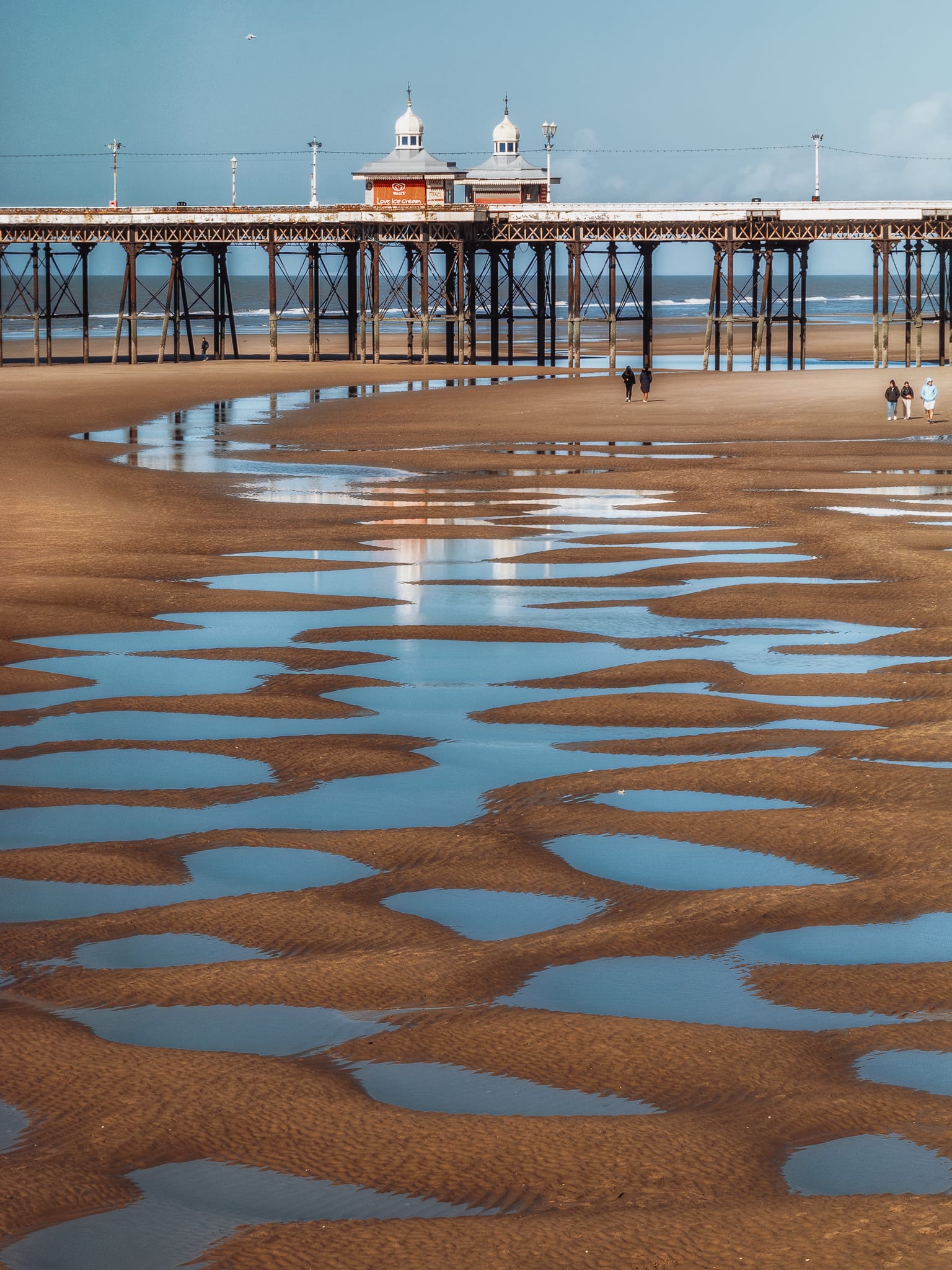 I could not resist shooting this composition towards the North Pier with all these sand pools lining the way. The pier was built in the 1860s; not only is it the oldest it’s also the longest of Blackpool’s piers.