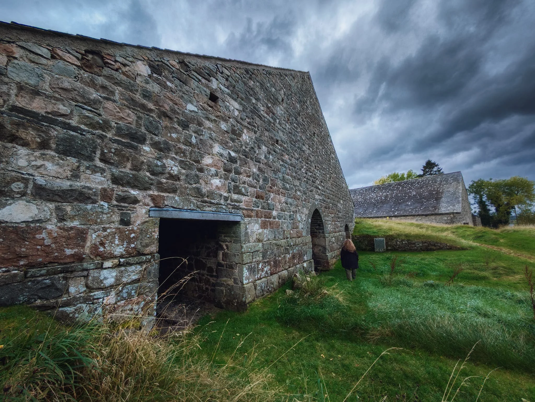 The abandoned buildings of Bonawe Iron Furnace. This building was one of two charcoal sheds, built into a bank so that material could be brought in at the back of the building, at the top of the slope, and removed at a lower level at the front. 