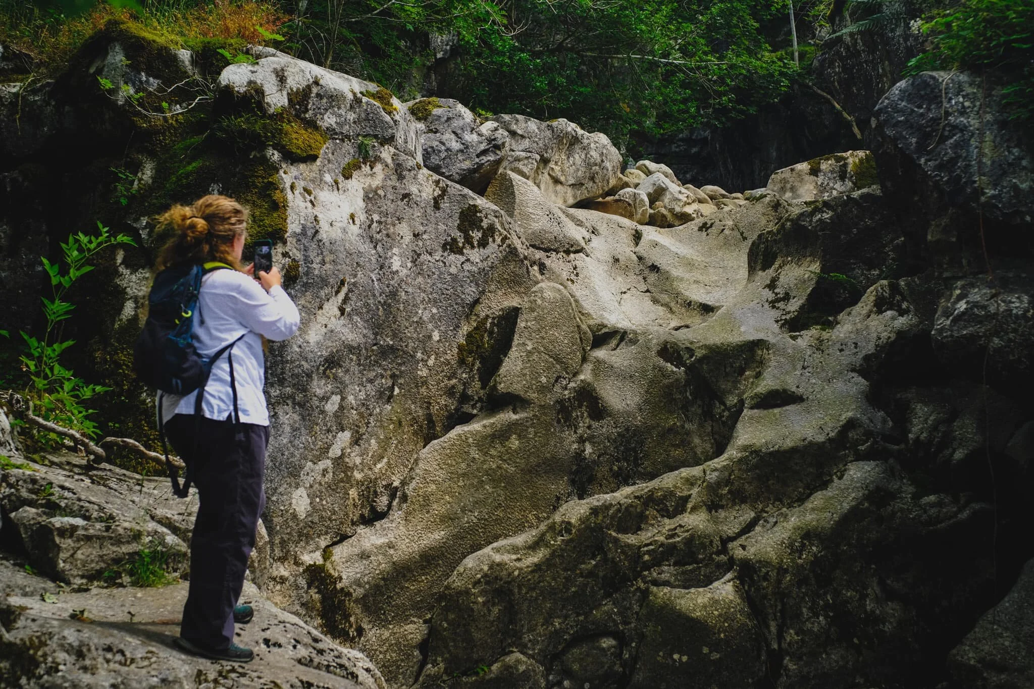  We followed the dry river bed east up Ease Gill to find our first &ldquo;waterfall&rdquo;. The gill is largely dry now—save for periods of heavy rain—as the limestone geology of the area is water soluble. This means that the water that once carved out this river and waterfall now disappears further up the gill into a deep cave system, many miles below. 