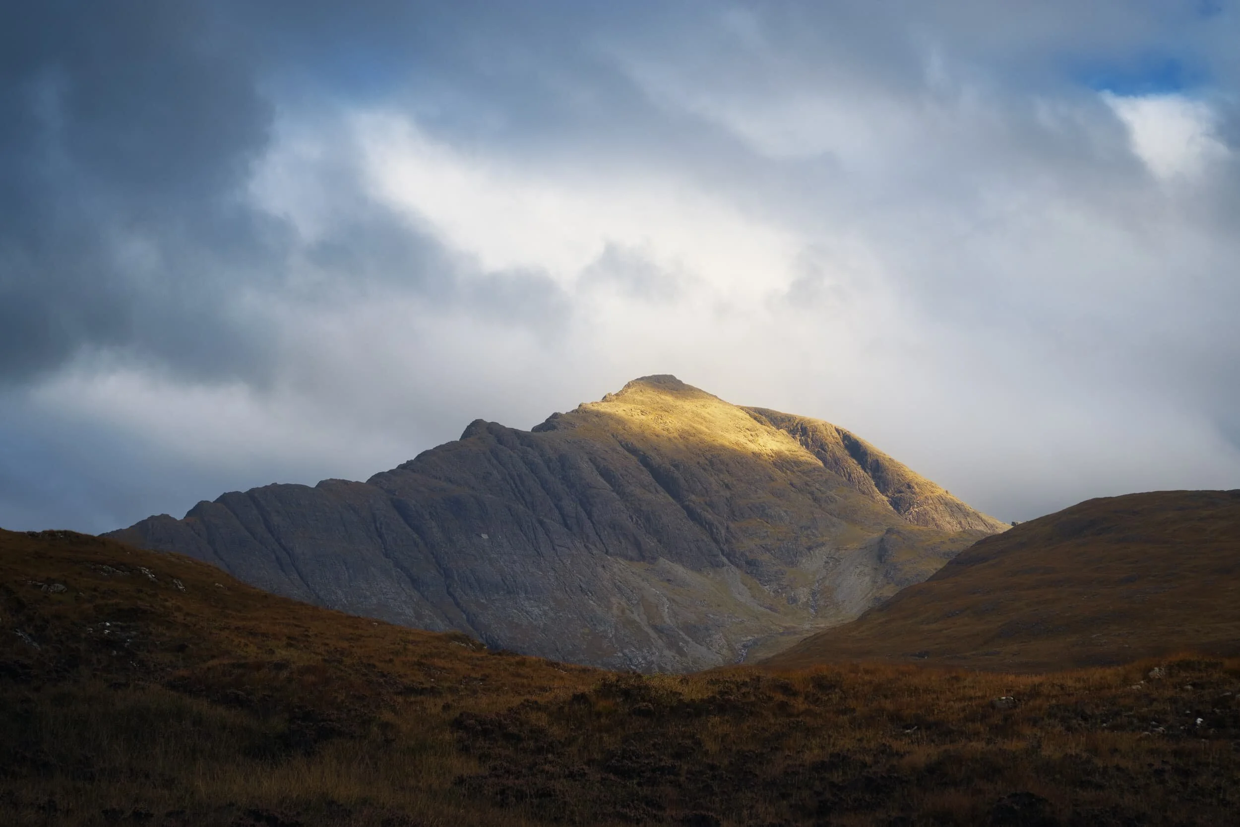  One of my favourite Skye mountains,  Blà Bheinn , is more famously  viewed  from the shore of Loch Slapin. But from this hike the mountain&rsquo;s fin-like southern ridge is more prominent, and I managed to snap this shot as the peak caught some morning light. 