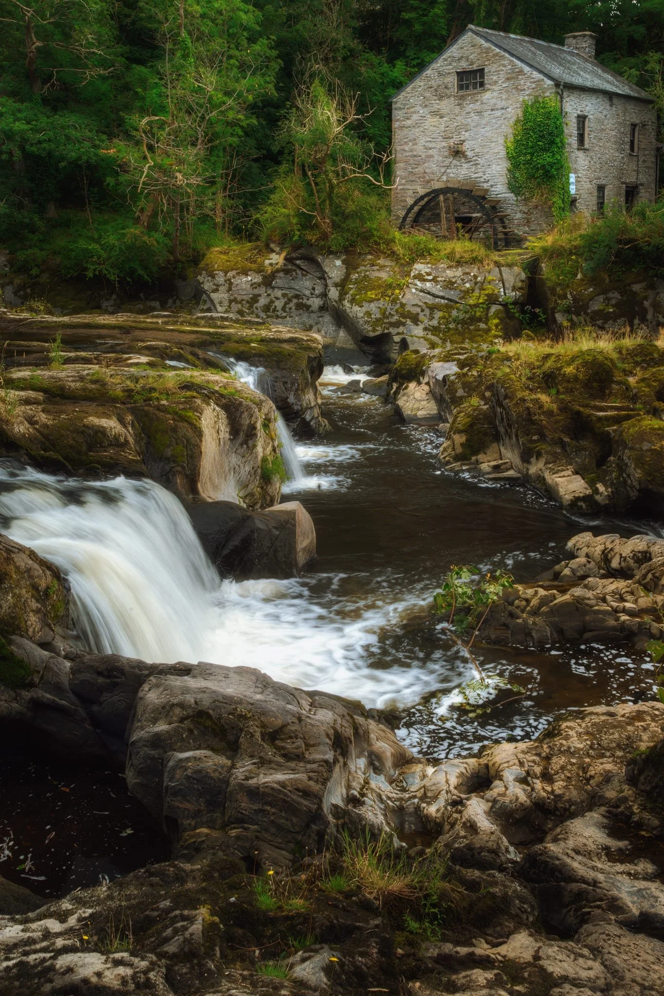  The mill, standing proud here  but no longer in use, was once powered by a leat that drew water from behind the falls during the 19th and early 20th centuries. It made for a pleasing and timeless composition. 