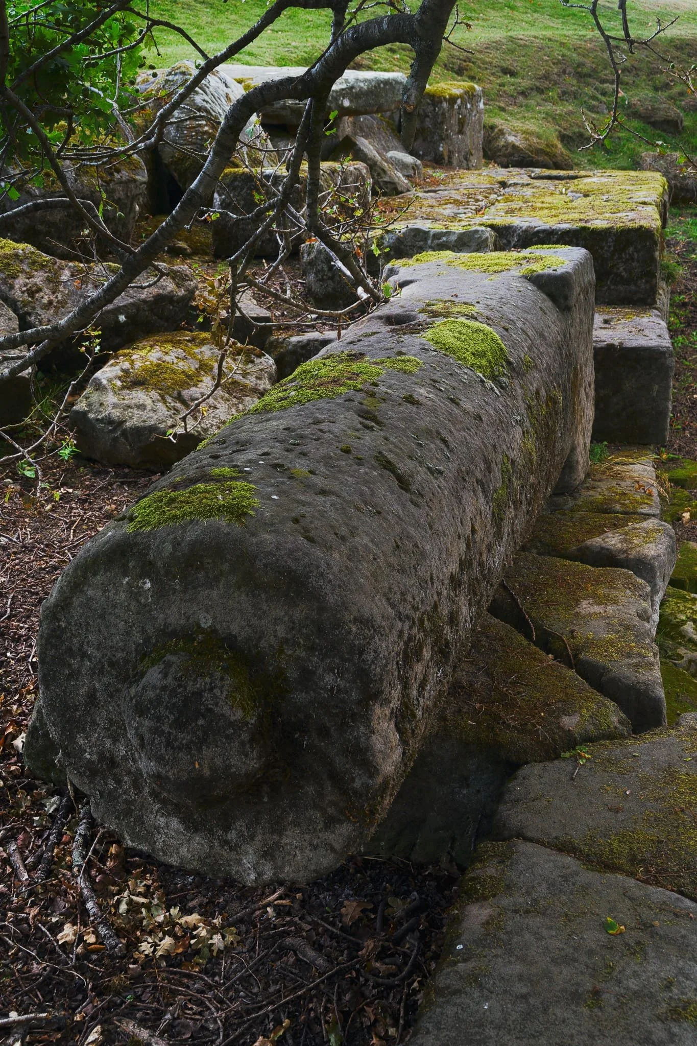  Lying on the abutment you can also find a stone column from the old bridge. People carved this. Two thousand years ago. 