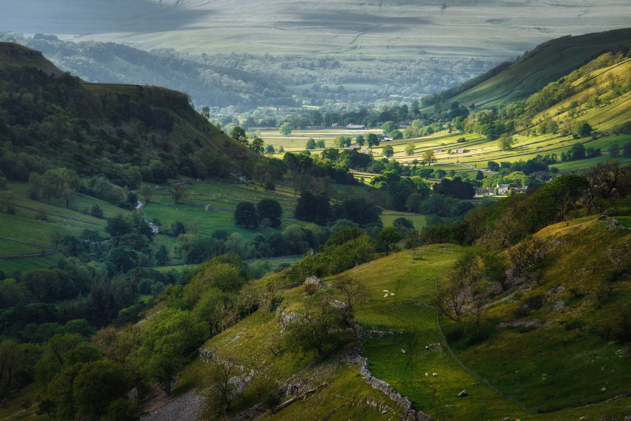  At the full 240 mm zoom, I pick out the farthest reaches of Upper Wharfedale as golden evening light scans across the dale. 