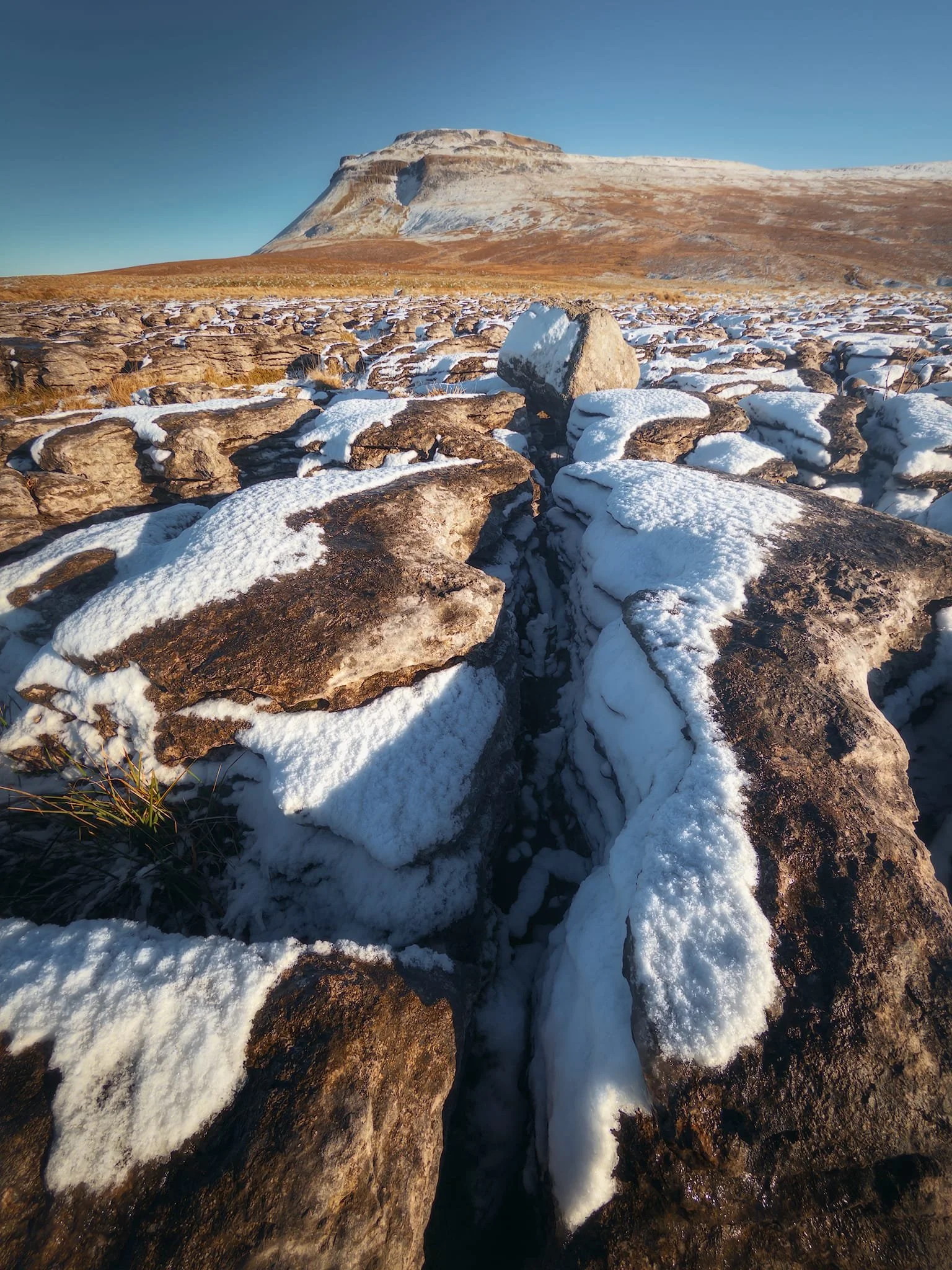  Carefully stepping around the clints and grykes so I don&rsquo;t snap an ankle, seeking compositions of some of the glacial erratics left on the pavement. 
