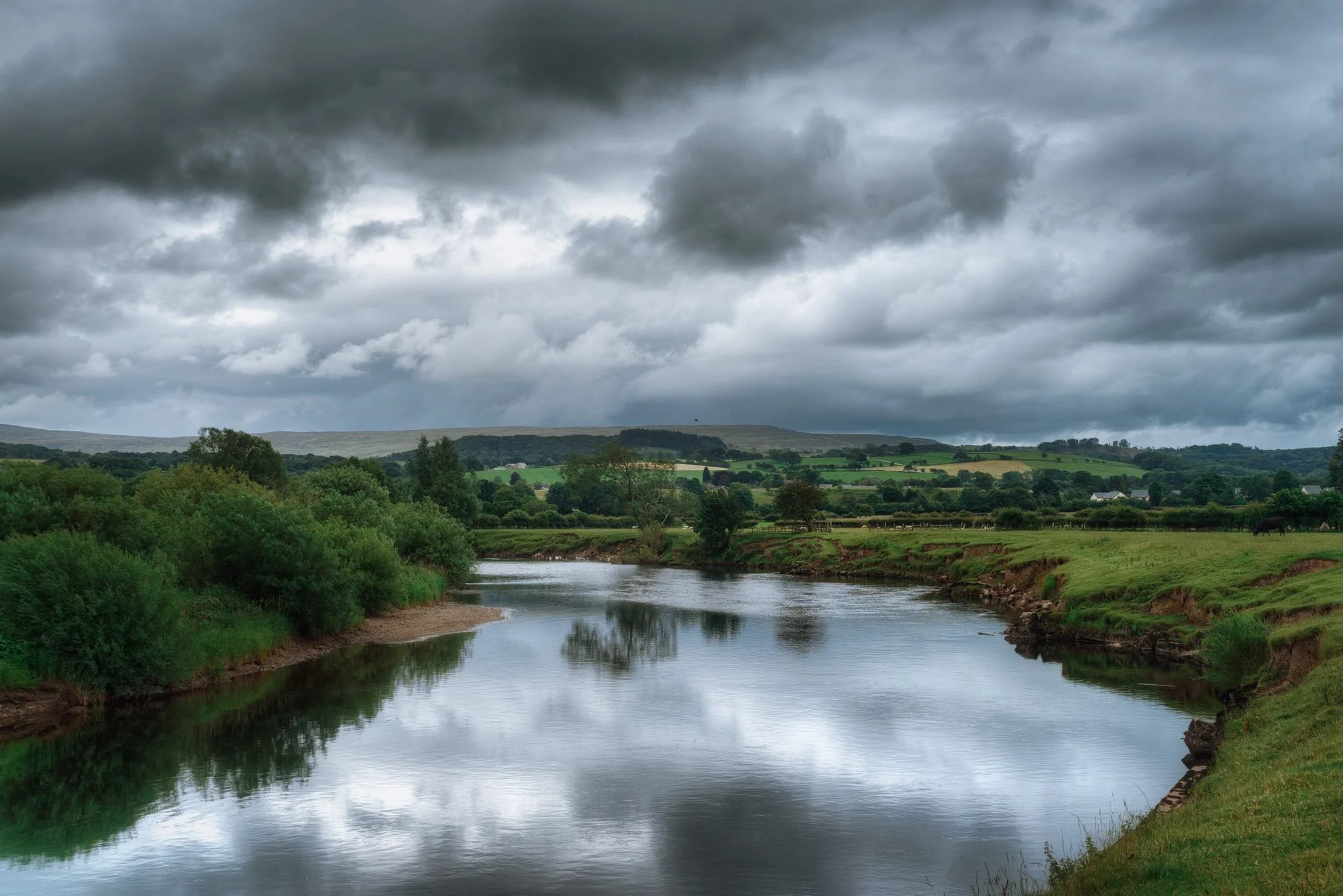 On the return leg back to Bull Beck picnic site, dramatic and foreboding clouds build up over the Bowland fells. A bend in the river, complete with glassy reflections, made me stop and attempt a composition. 