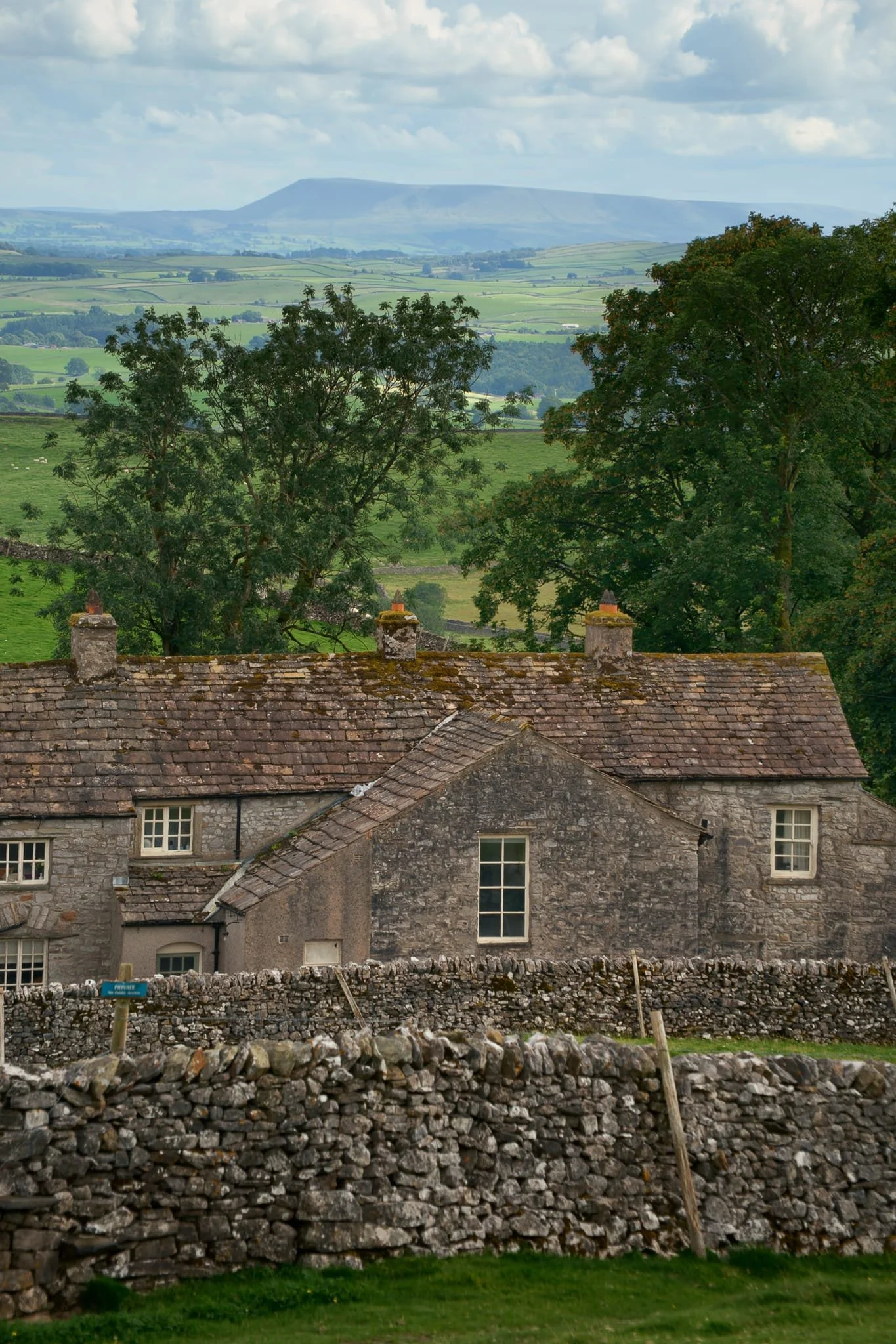 As we ascended up the valley side, a look back south over Crummack Farm revealed clearer light, with Pendle Hill clear as a bell 30 km away. 
