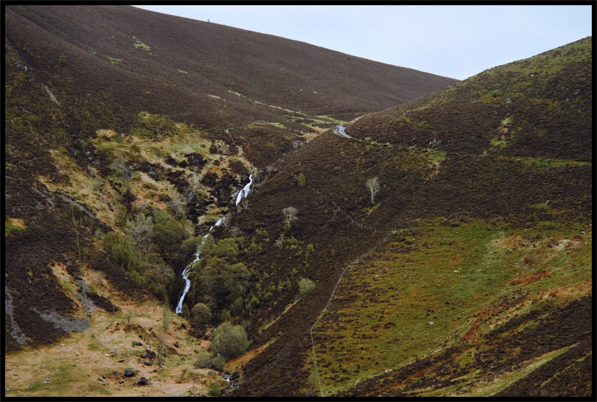  One last look back, a zoomed in composition of Dash Falls as it cascades down the sheer face of Dash Valley&rsquo;s head. 