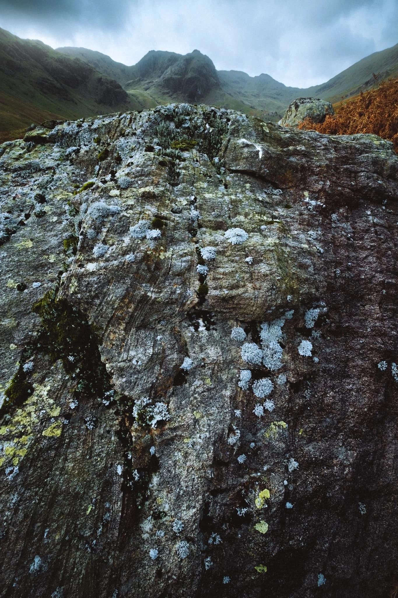  I got real close to the glacial erratic, noting its wonderful lines, textures, and colours. I elected for a near-far ultra-wide composition, showcasing the strata in the boulder and Greenhow End above. 