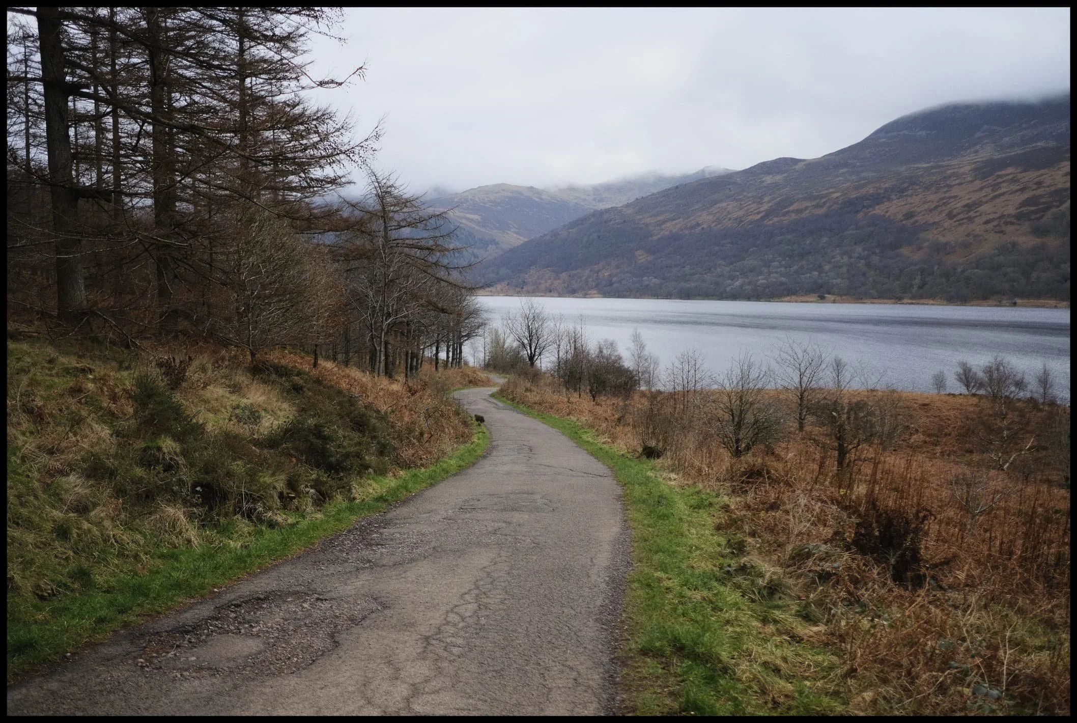  Following the road from the car park, the views open up and reveal the huge Ennerdale fells tussling with the clouds above. 