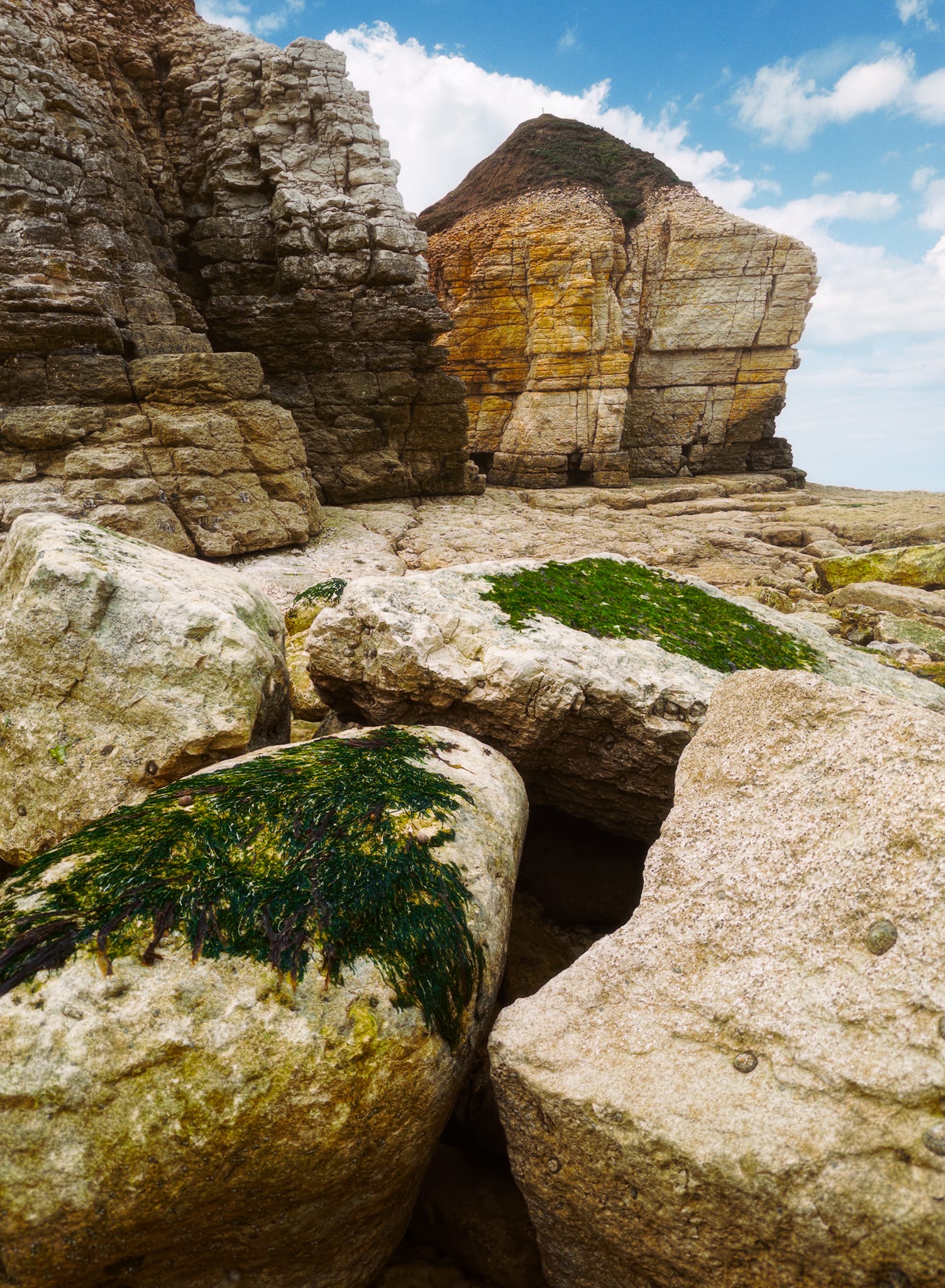 With only a small window whilst the tide was out, we quickly clambered down the cliffs to explore Thornwick Bay. Chalk boulders gave me this nice composition towards the curiously-shaped Thornwick Nab.