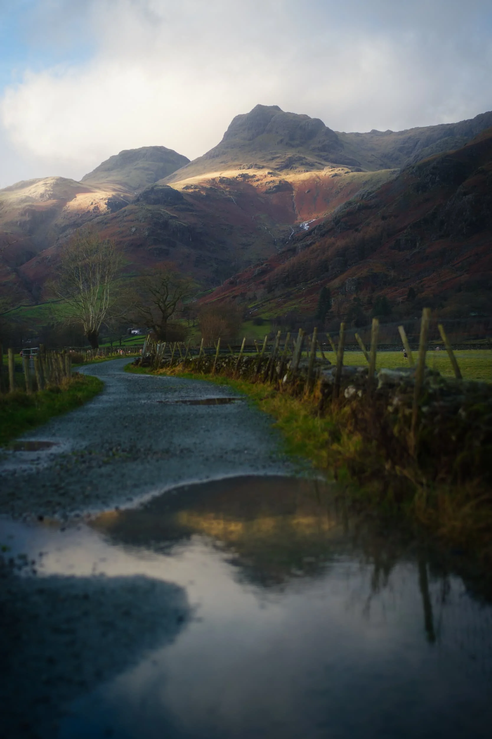  There were plenty of puddles on the trail, which enabled to shot a composition of the Langdale Pikes I&rsquo;ve been after for a long time. 