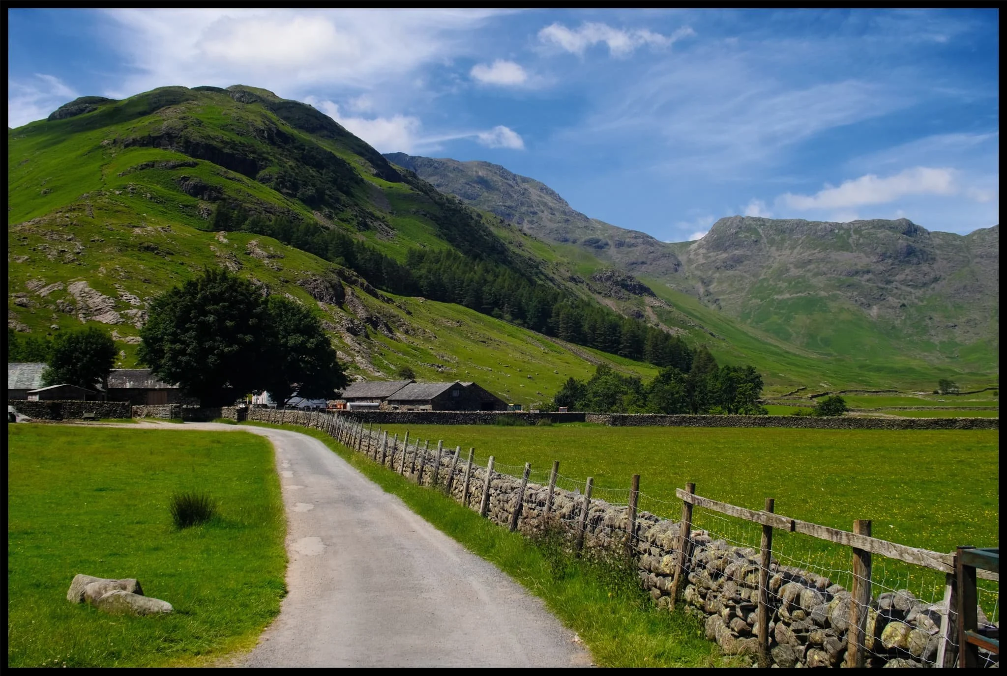  The road to Stool End Farm, which marks the beginning of many popular ascents up to the likes of Bowfell, Crinkle Crags, and beyond. 