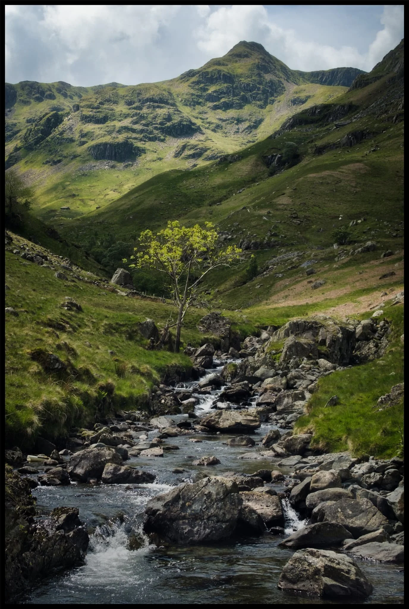  Crossing the boggy valley floor at Grisedale Beck, Dollywaggon Pike still demanding attention as its sunlit peak acts as a beacon. 