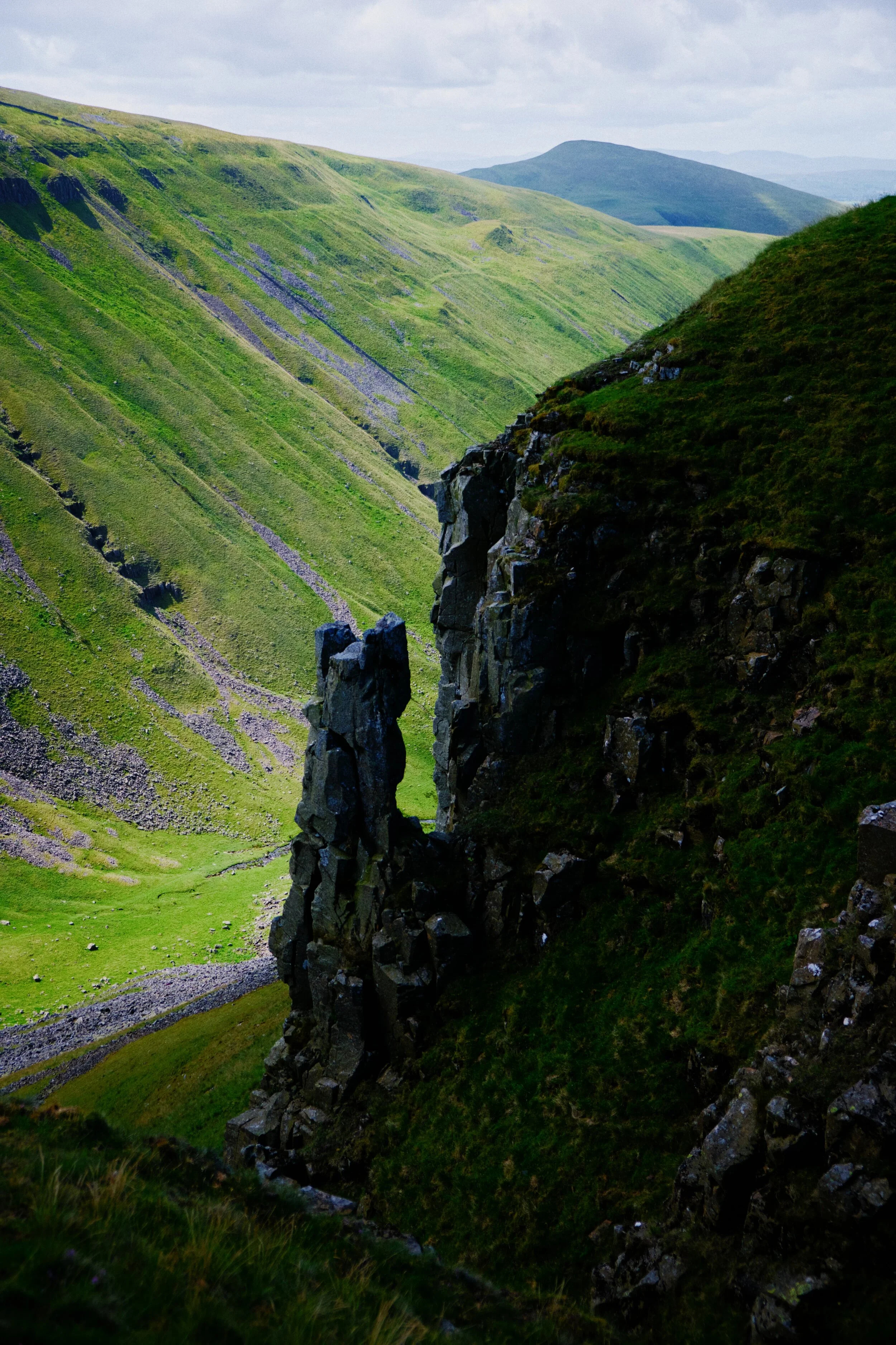  This particular column of Whin Sill is known as Nichol&rsquo;s Chair, named supposedly after a local cobbler who was challenged to climb the pinnacle then sole and heel a pair of shoes on its top. 