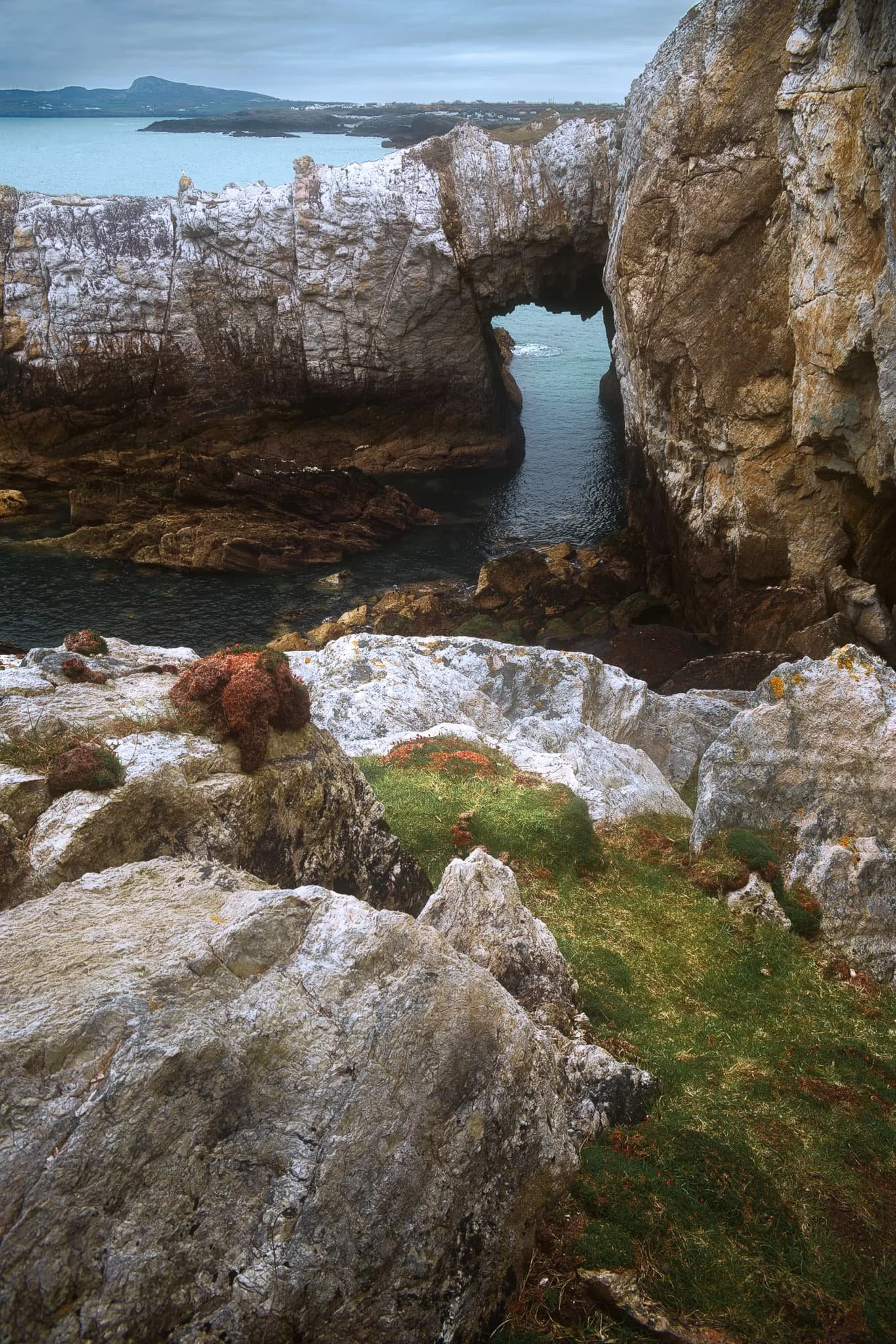  Rhoscolyn Head is also known for two sea arches that have been carved out of the cliffs over the course of millennia. After sighting this one from above, we scrambled down the cliff side for a closer look. This is Bwa Gwyn, &ldquo;the white arch&rdquo;. 