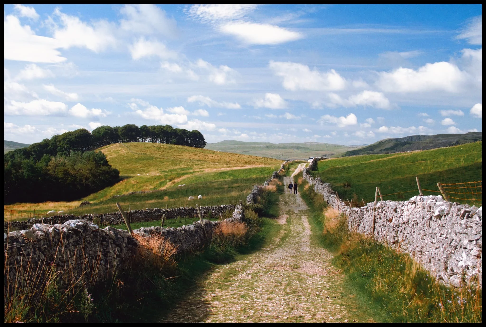  Fellow hikers make their way back down to the valley bottom after climbing Pen-y-Ghent. 