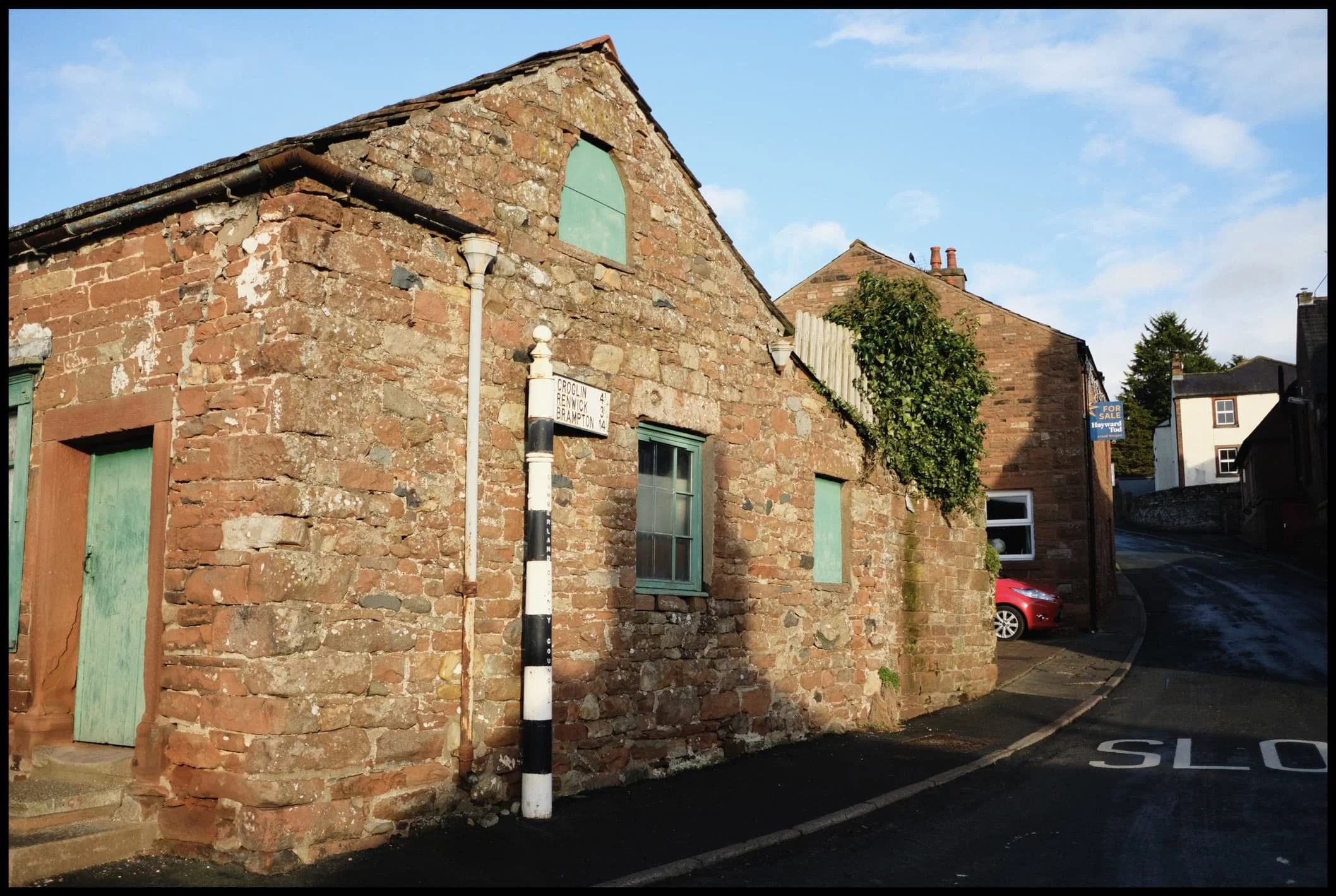  Victorian-era road signage, which still references Cumberland County Council. 