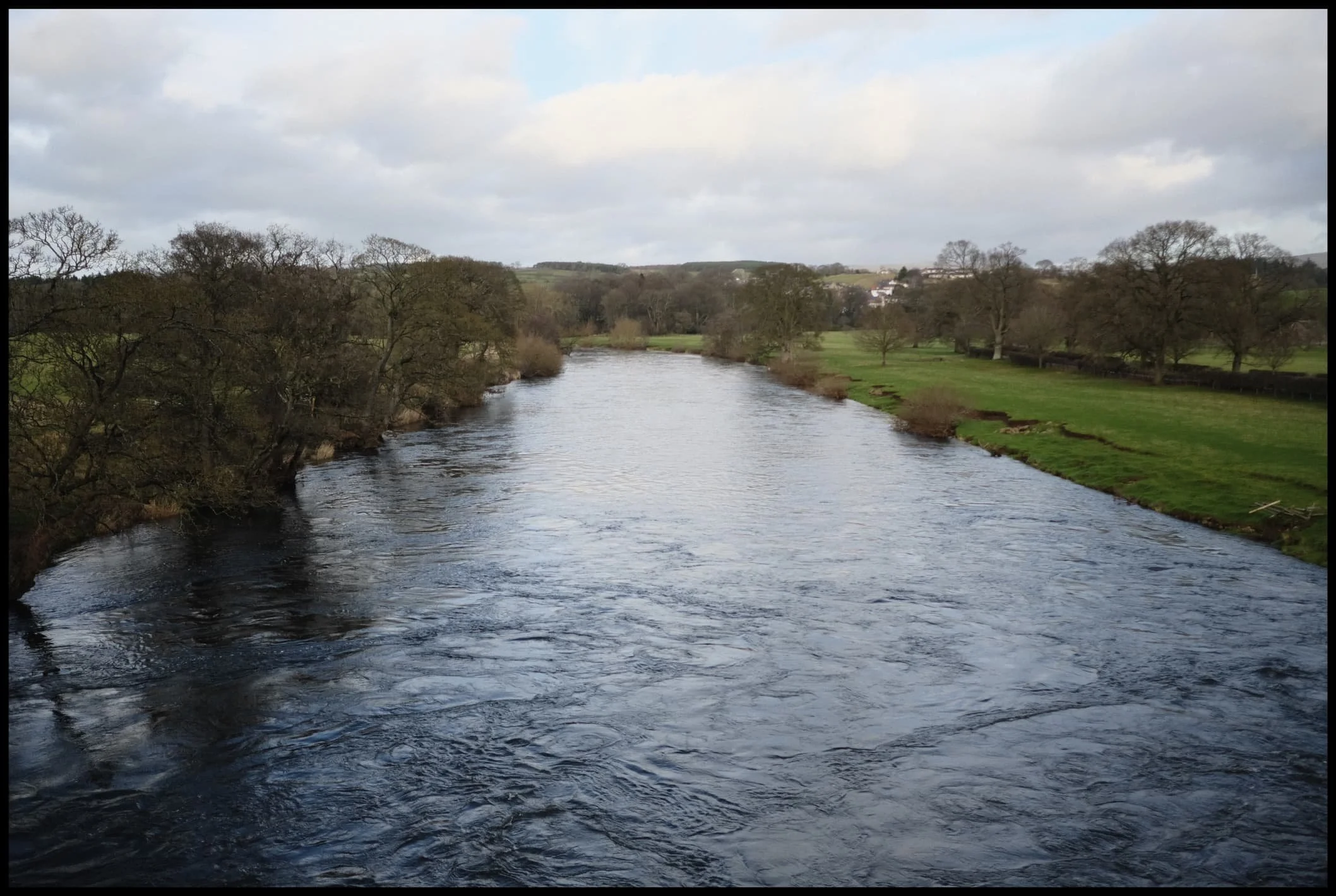  A high and fast-flowing River Eden from the top of Eden Bridge. 