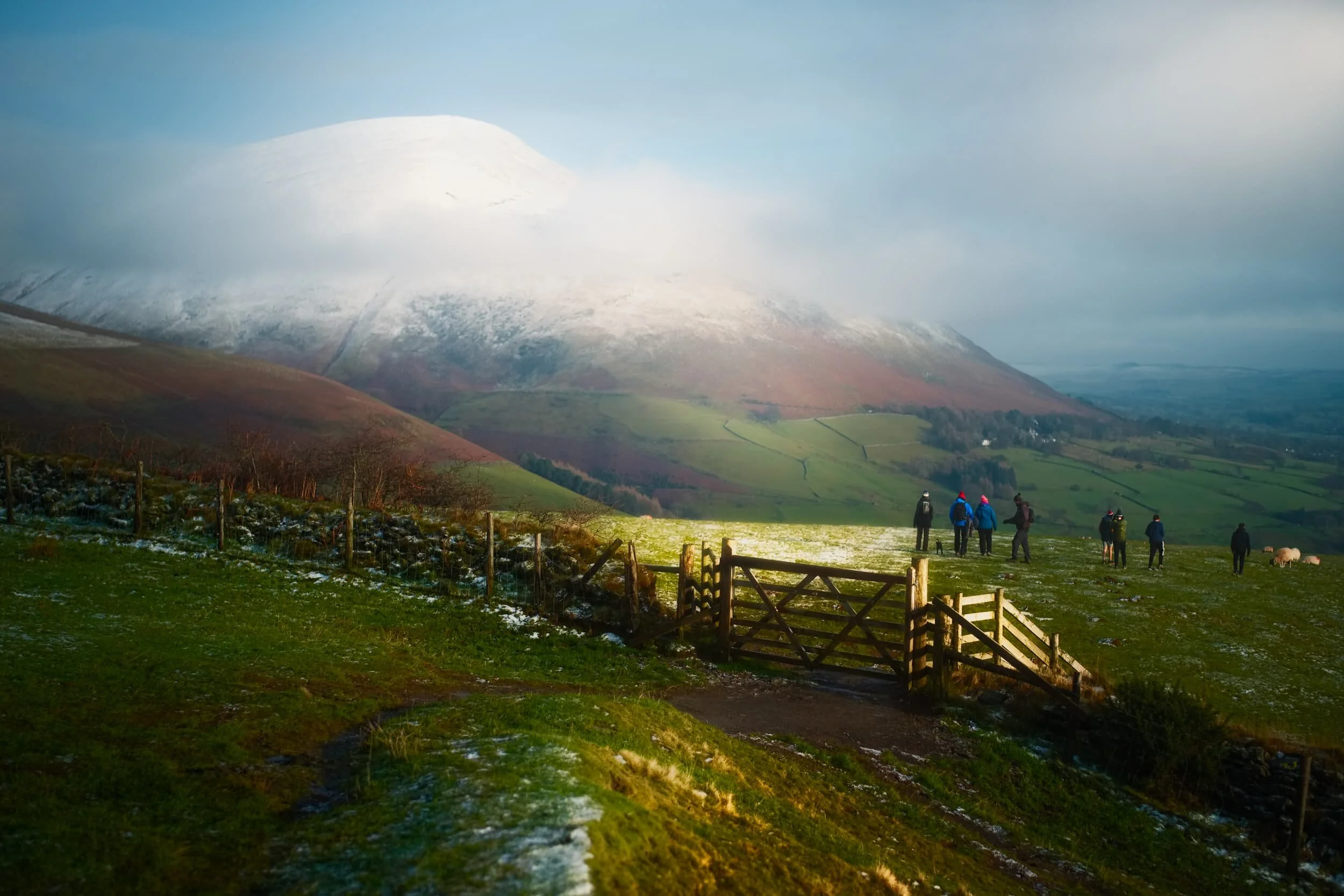  Away from the sun we continued on the summit track back down Latrigg&rsquo;s eastern shoulder, affording us wonderful views of a snow-clad Blencathra (868 m/2,848 ft). More mist streamed in to partially obscure the views of the mighty fell. 