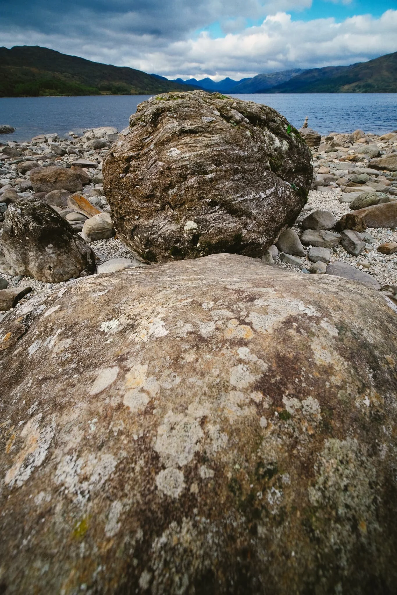  We clambered down to the eastern shore of this spit of land, and I was of course delighted to find various boulders strewn around. On went my ultra-wide lens, and I began making compositions. 