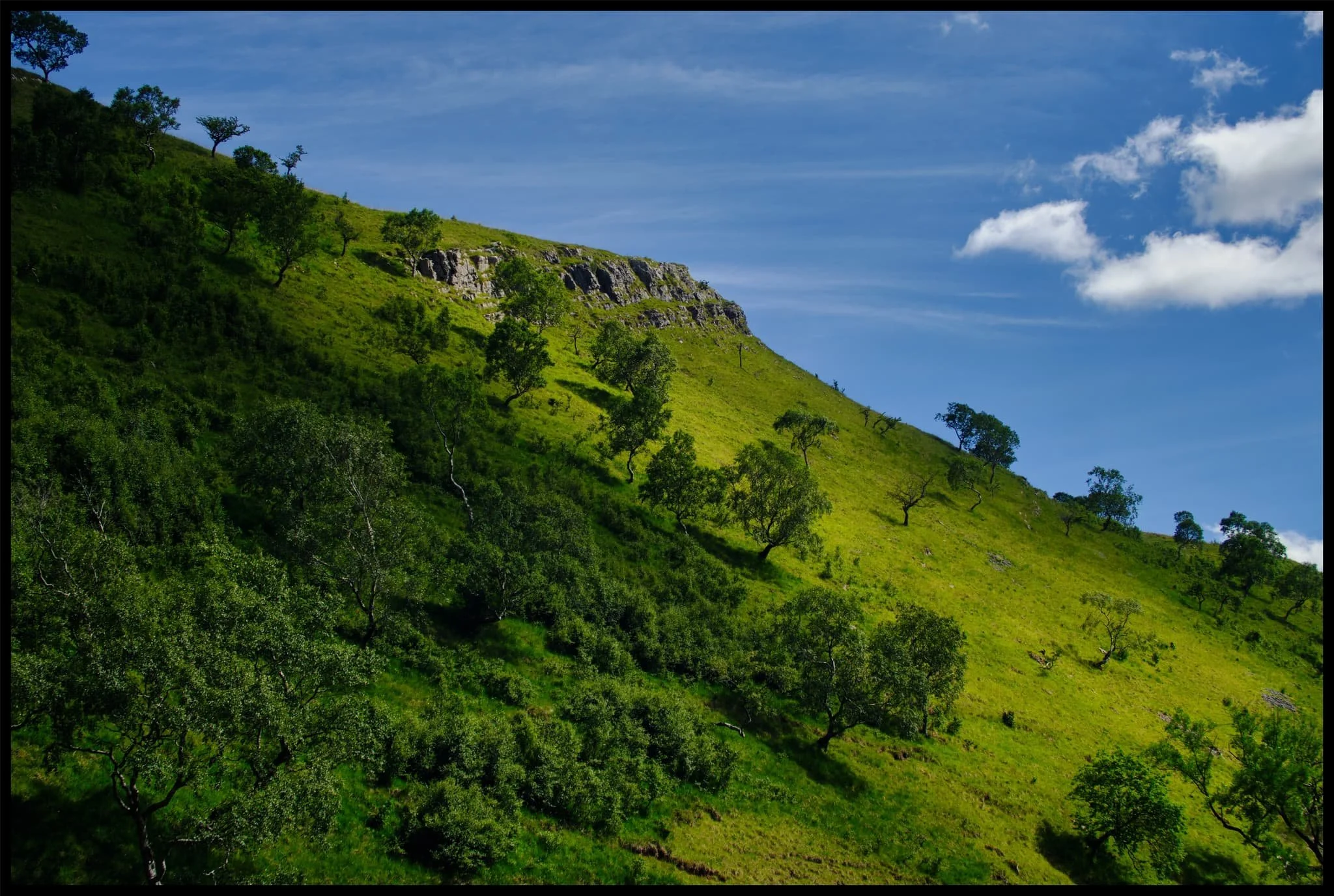  High above us, passing clouds created gorgeous gradients of light and shadow across the fellsides. 