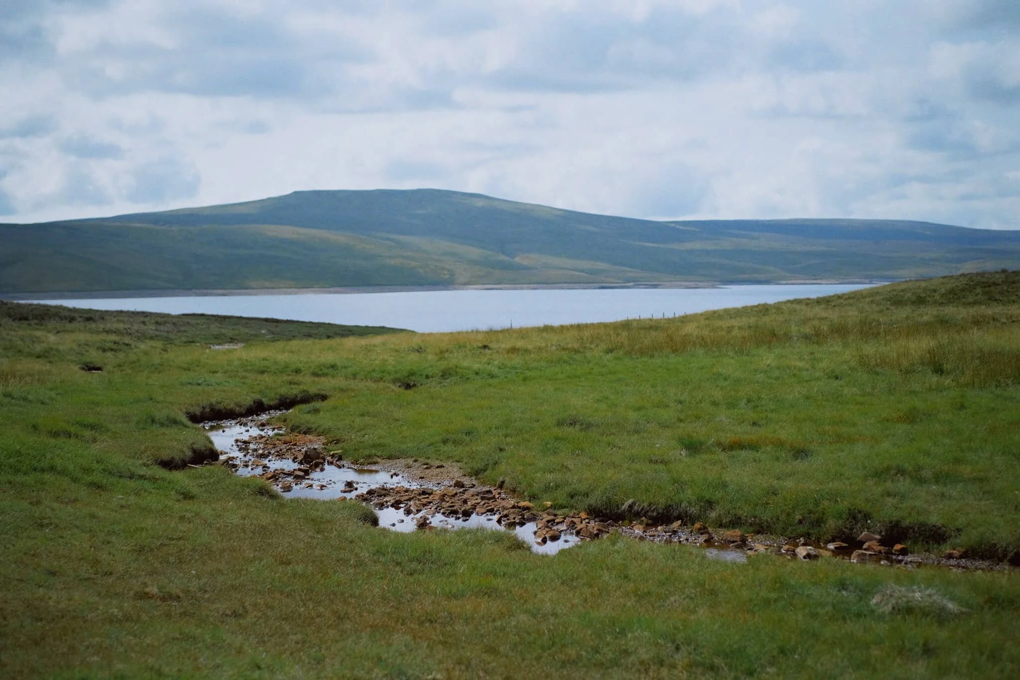  After a break for lunch, we drove a few miles west and parked at Cow Green Reservoir, seeking out Cauldron Snout. Along the way, views across the reservoir can be had of Meldon Hill (767 m/2,517 ft). 