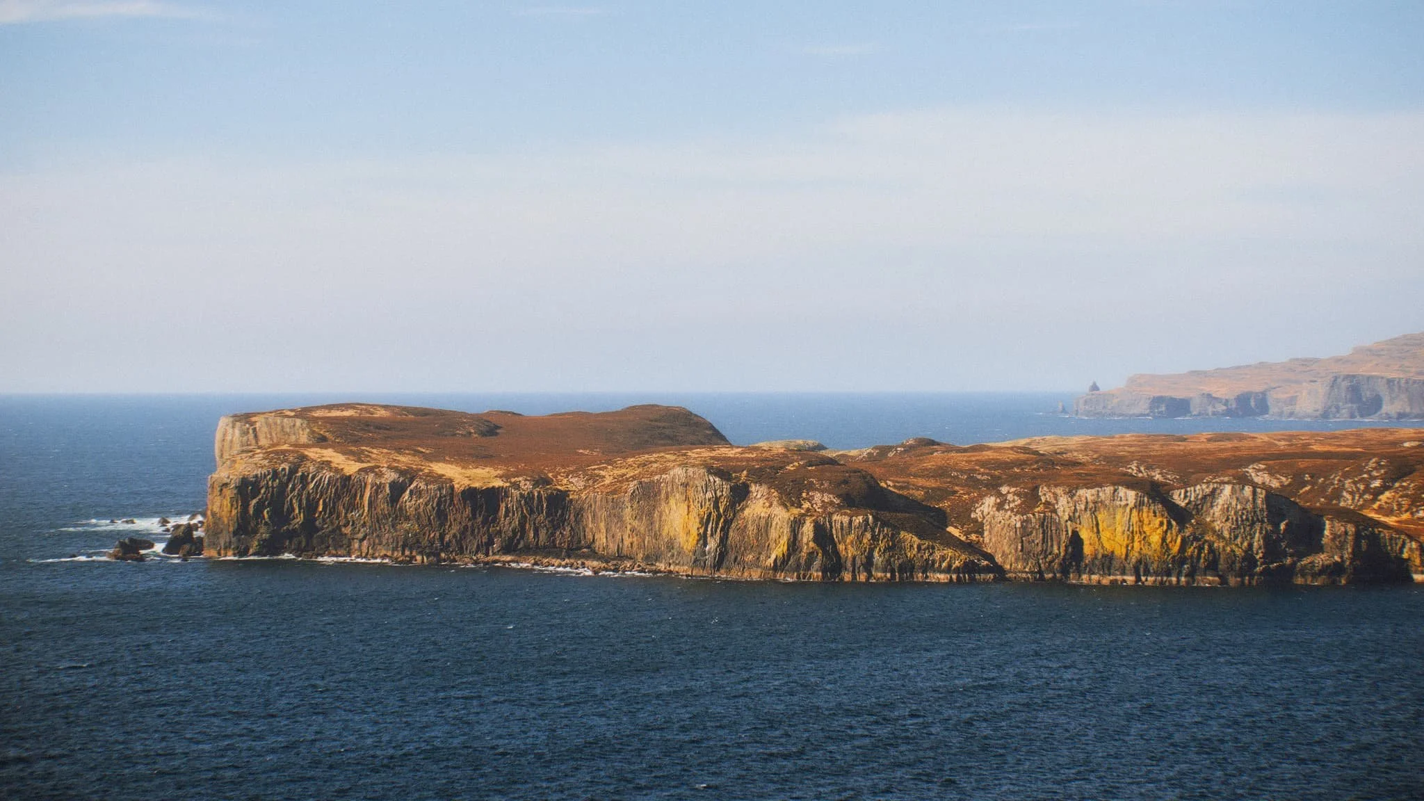  Once on the island it&rsquo;s simple enough to navigate your way towards the highest cliffs. Once there, you get stunning views like  this . Zoomed in, the island of Wiay is clear and you can even make out the cliffs and sea stacks of MacLeod&rsquo;s Maidens. 