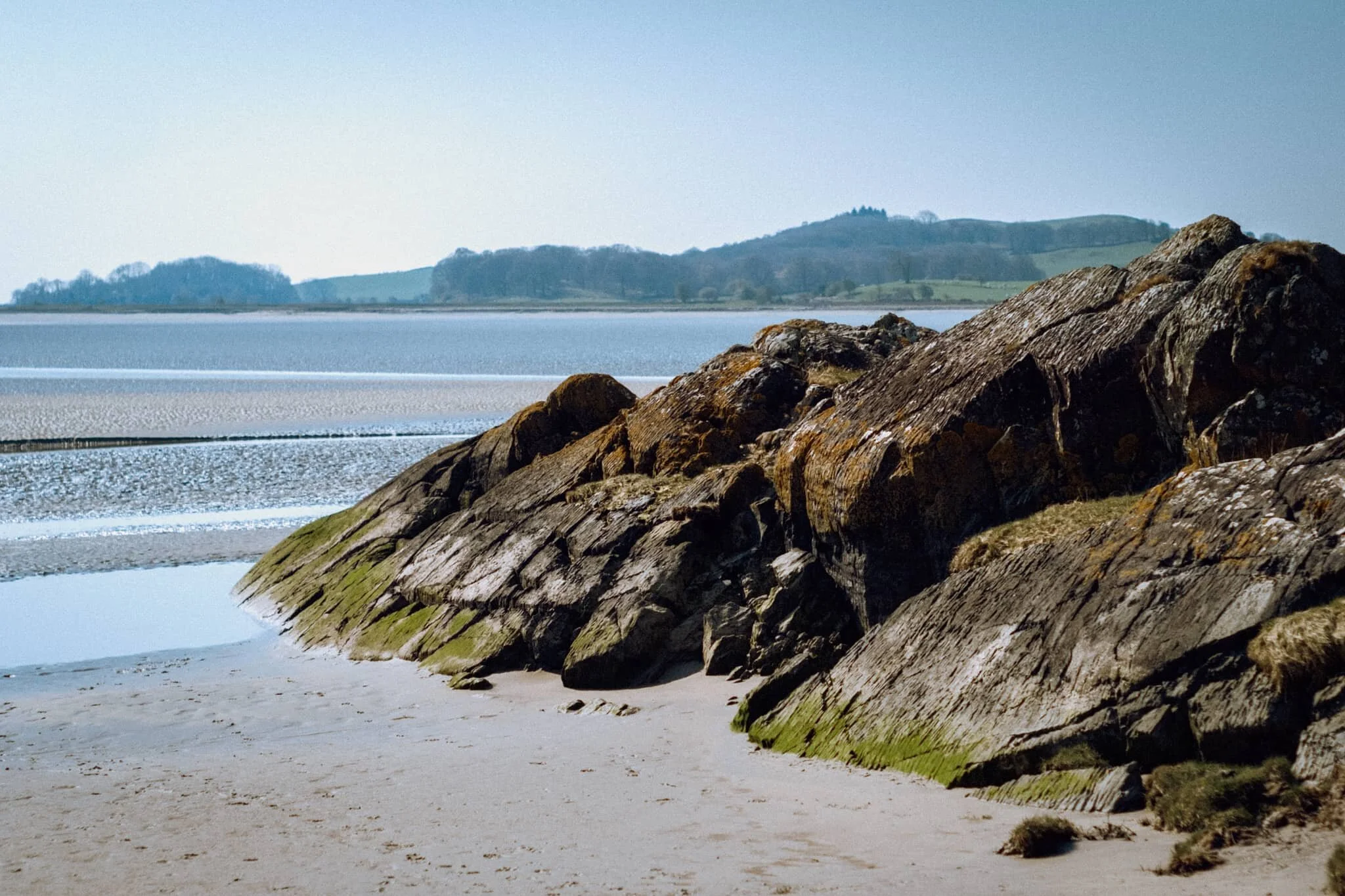  After completing the Woodland Trail, we joined the Cumbria Coast Way west towards the Levens Estuary. I knew there would be sand and mudflats ahoy as the estuary is linked to Morecambe Baby, but I had no idea there were these rocky outcrops along the coast. 