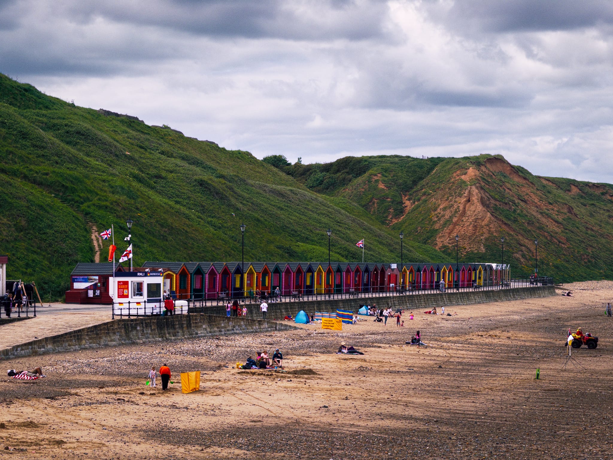 At the beach, a row of beach huts caught my eye, resplendent in their bold colours and style reminiscent of traditional, mid-20th-century British beach huts.