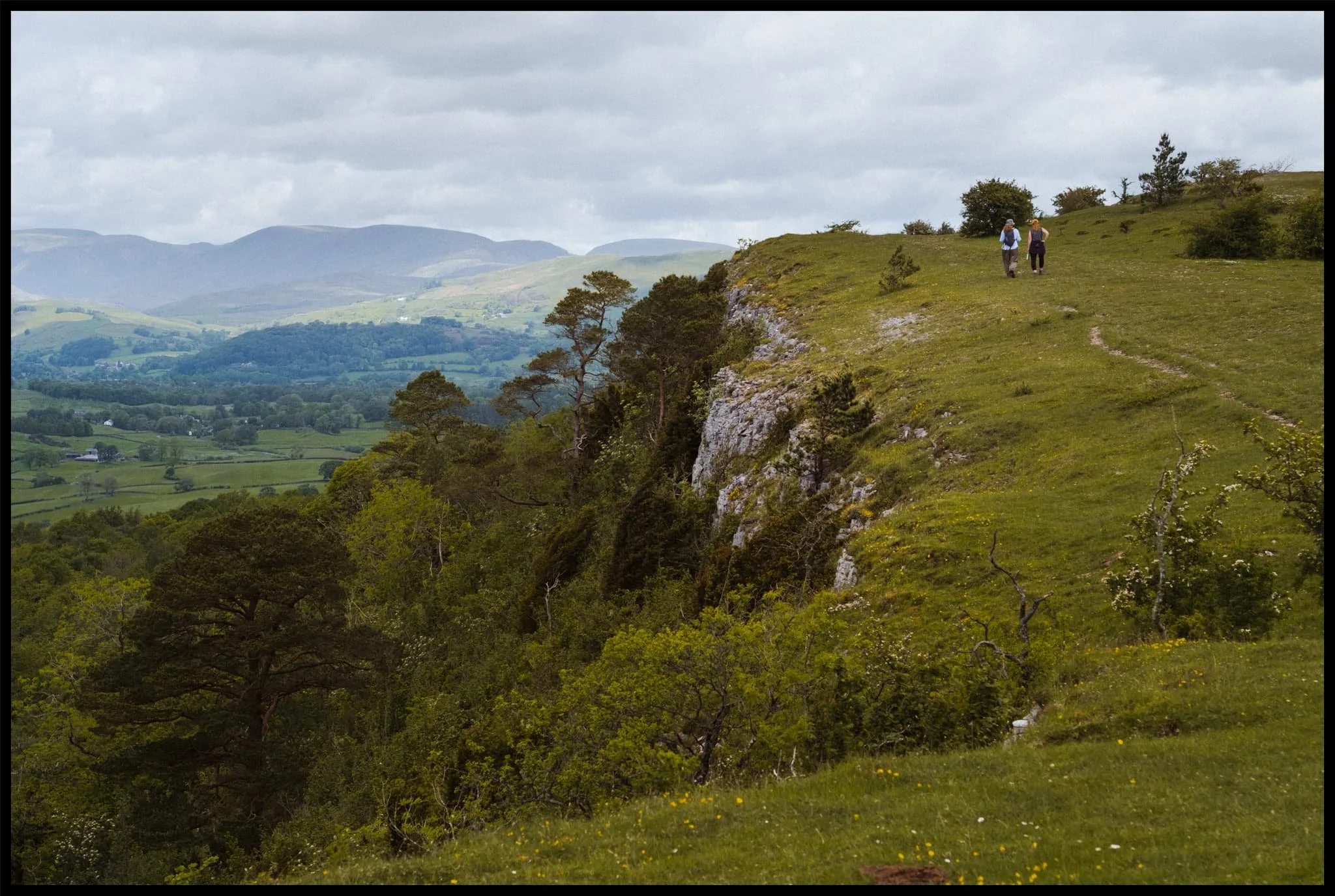  Beyond the nick of Hodgson&rsquo;s Leap, Lisabet and her sister were motoring on ahead, heading towards the Mushroom. In the distance, the Kentmere fells, clear as a bell. 