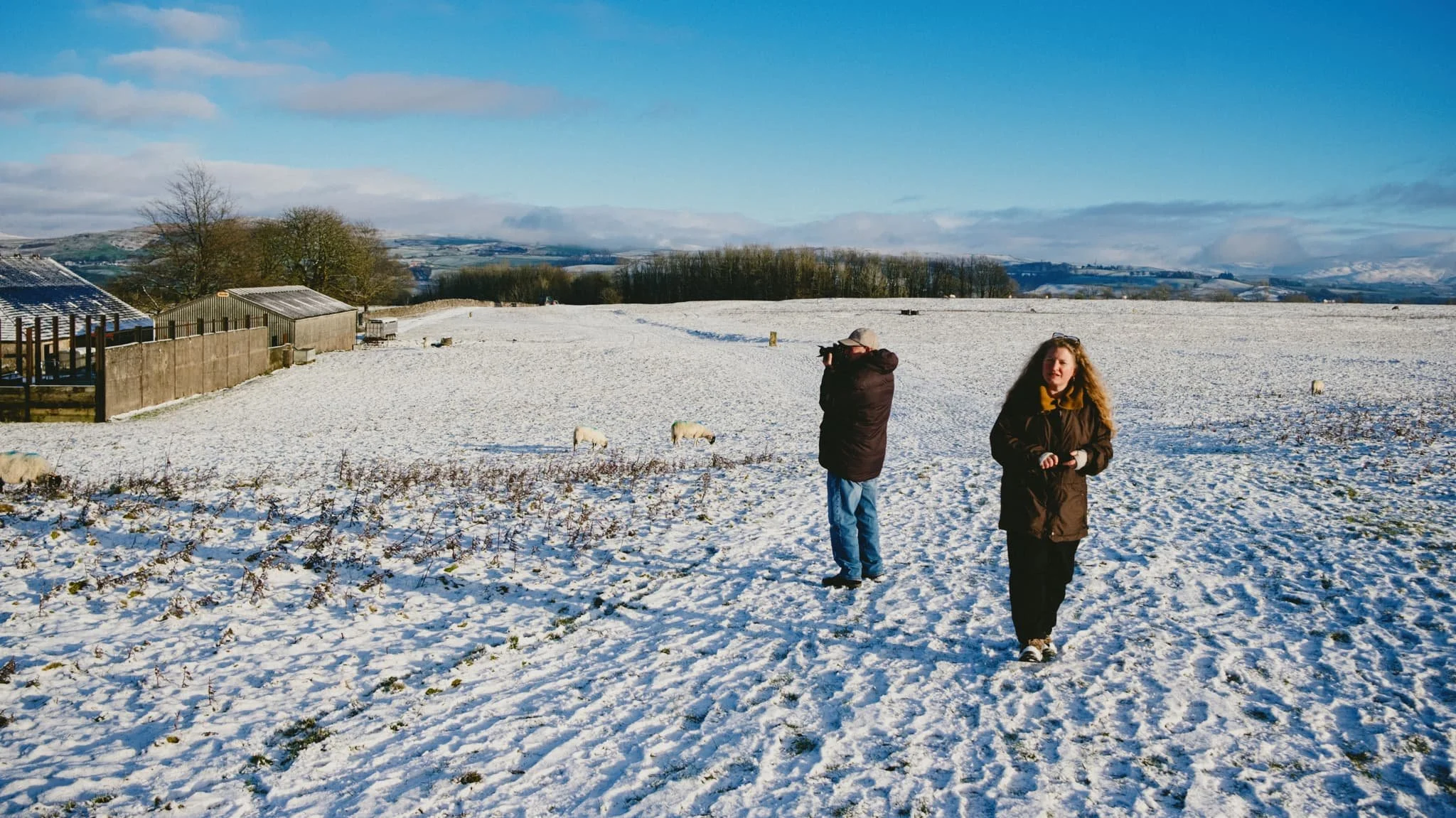  My lovely Lisabet and my Dad, taking in the scenery in their own ways. Far, far in the distance are the comely shapes of the  Howgills , covered in fresh snow. 
