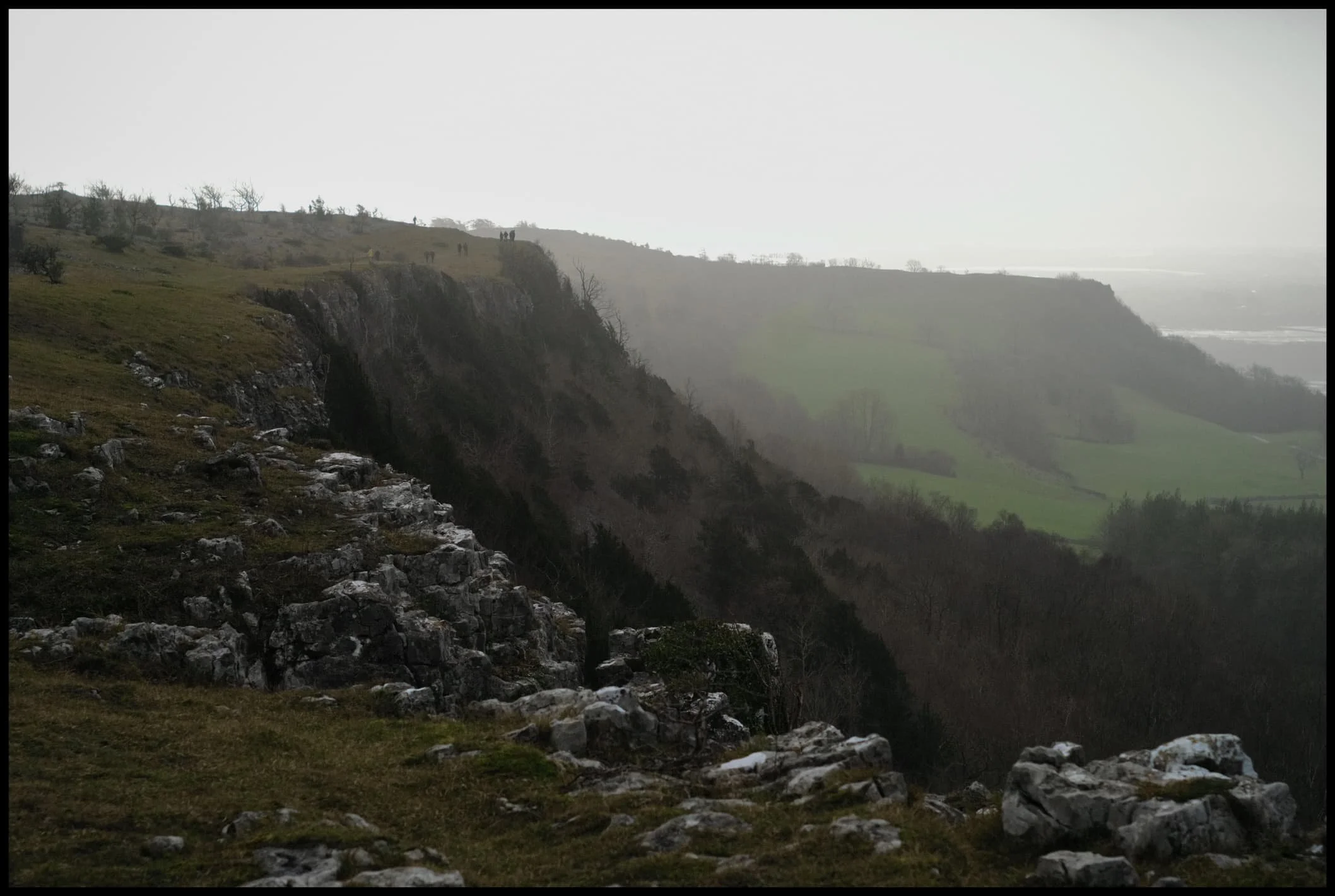  The swirling clouds, full of moisture, suffused the sunlight, and drenched the winter limestone landscape in golden light. 