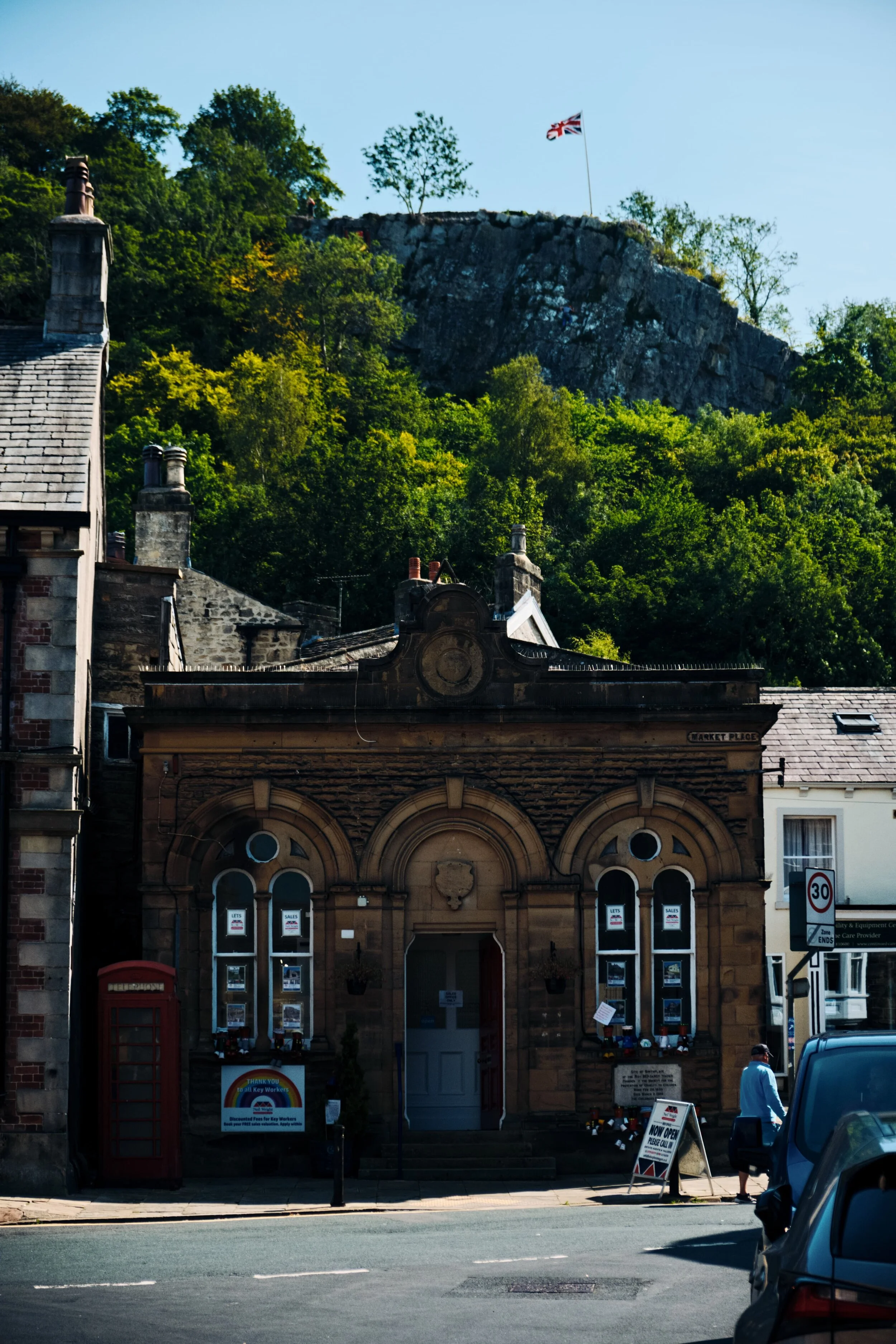  Settle town centre really is a mish-mash of beautiful architecture. 300 ft above is Castlebergh, a limestone crag that&rsquo;s nearly always home to a Union Jack. 