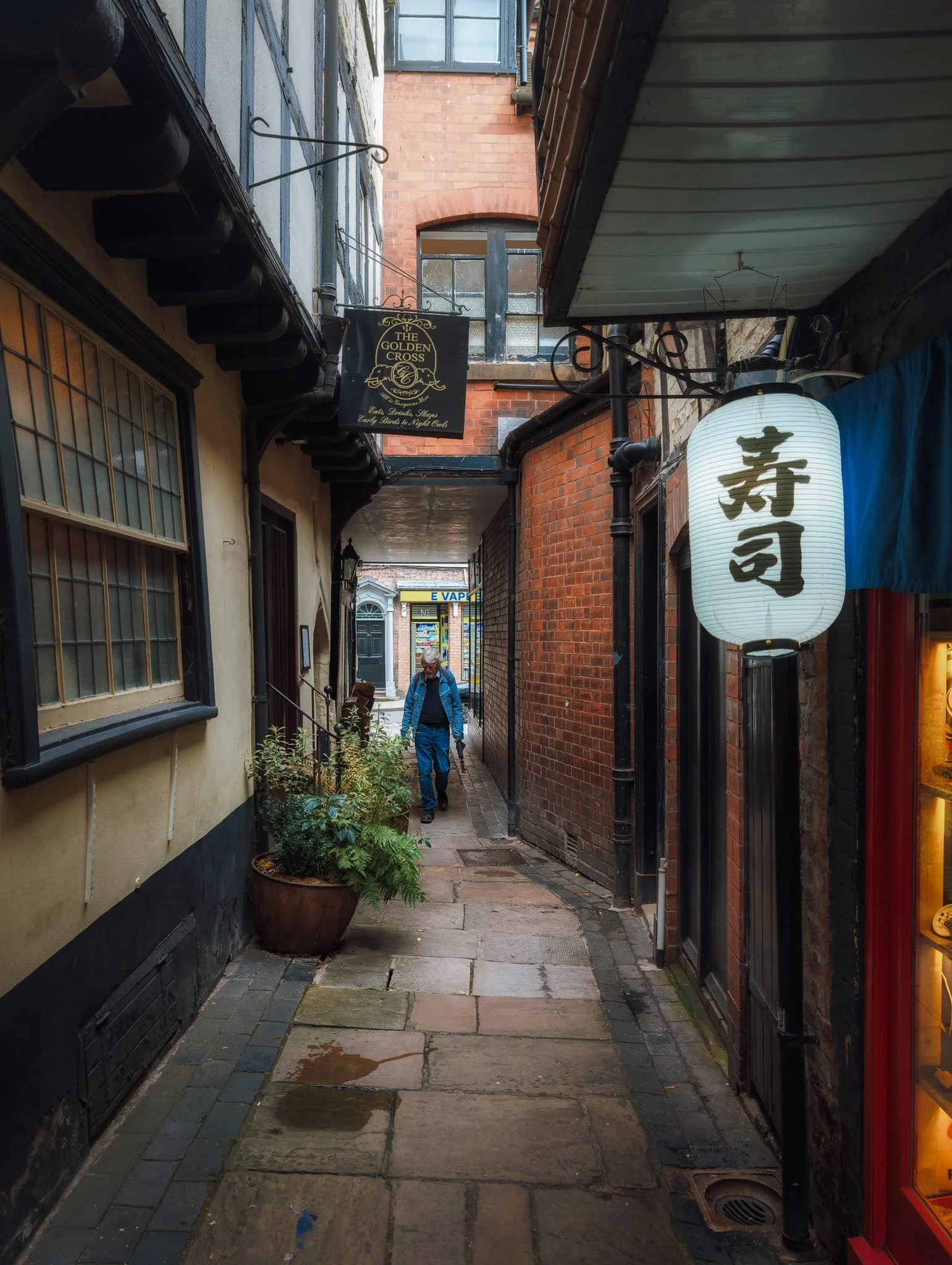  As the rain started to follow, we figured it was time for food. Down another narrow lane, Golden Cross Passage, we find  Umai , a Japanese restaurant. 
