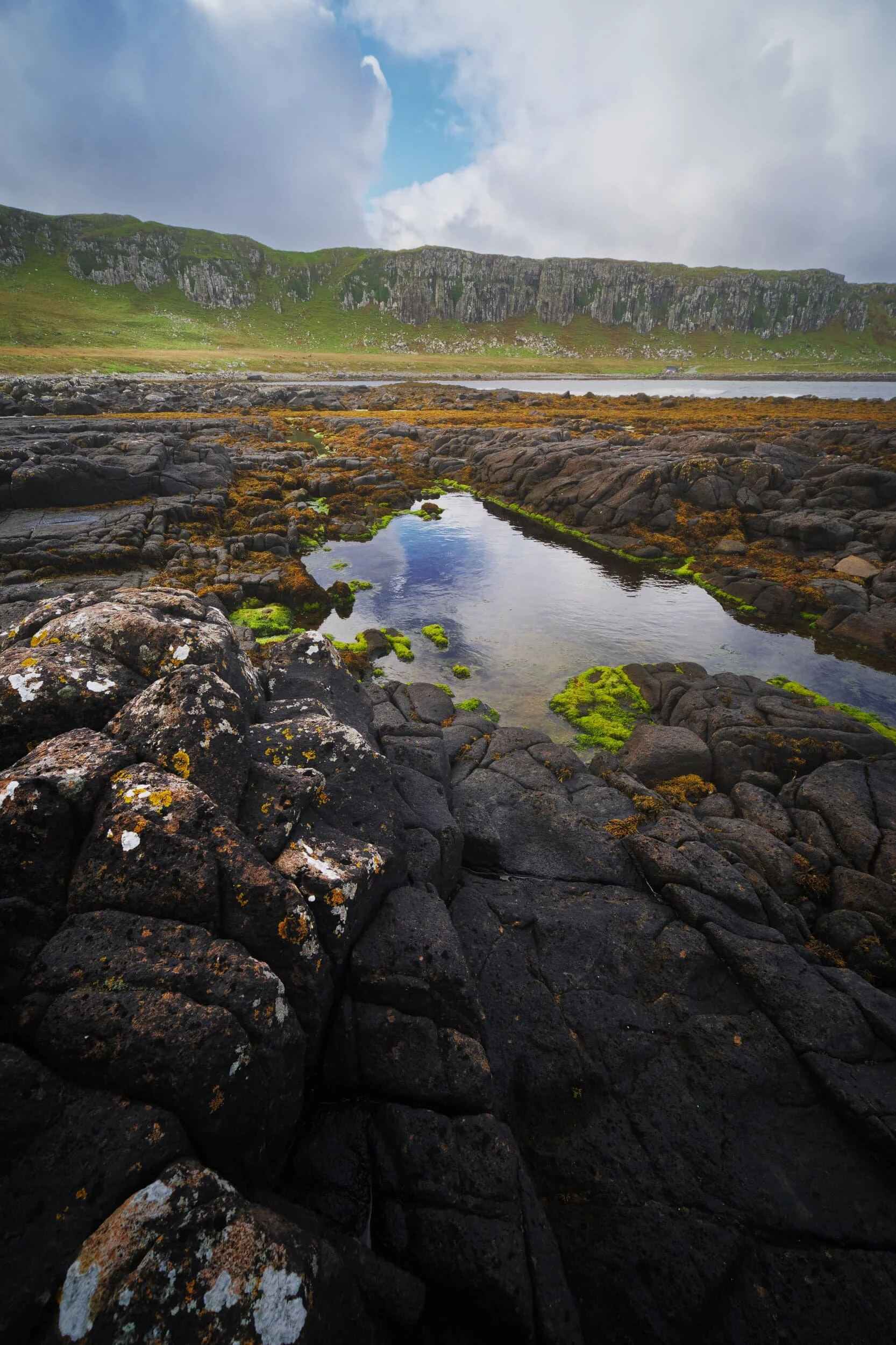  A simple composition showing off the tetris-like structure of the raised rock bed at  Breun Phort , looking back towards the 50 ft cliffs that dominate the  An Corran  coast. 