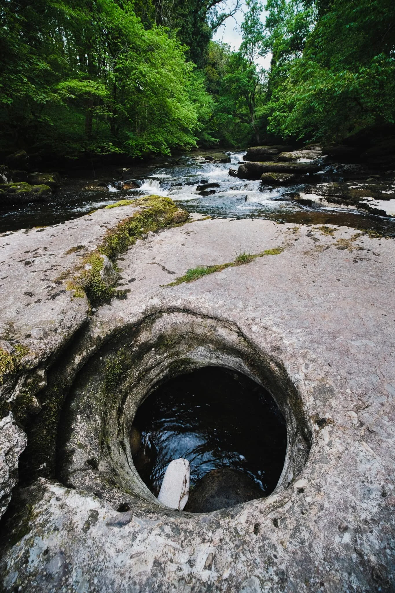  One of the ledges in the river features this hollowed out hole with the river running underneath it. 