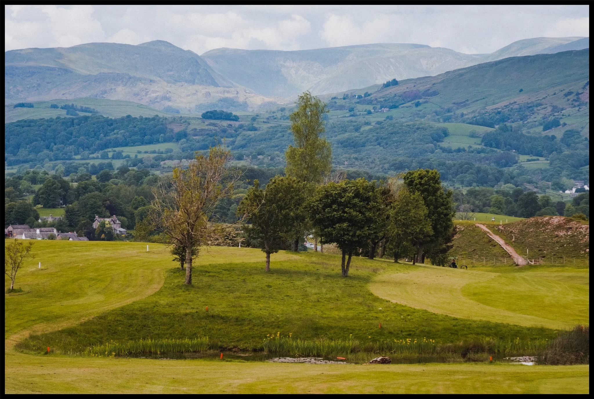  Using the landscaping features of the golf course as leading lines towards the distant Kentmere fells. 