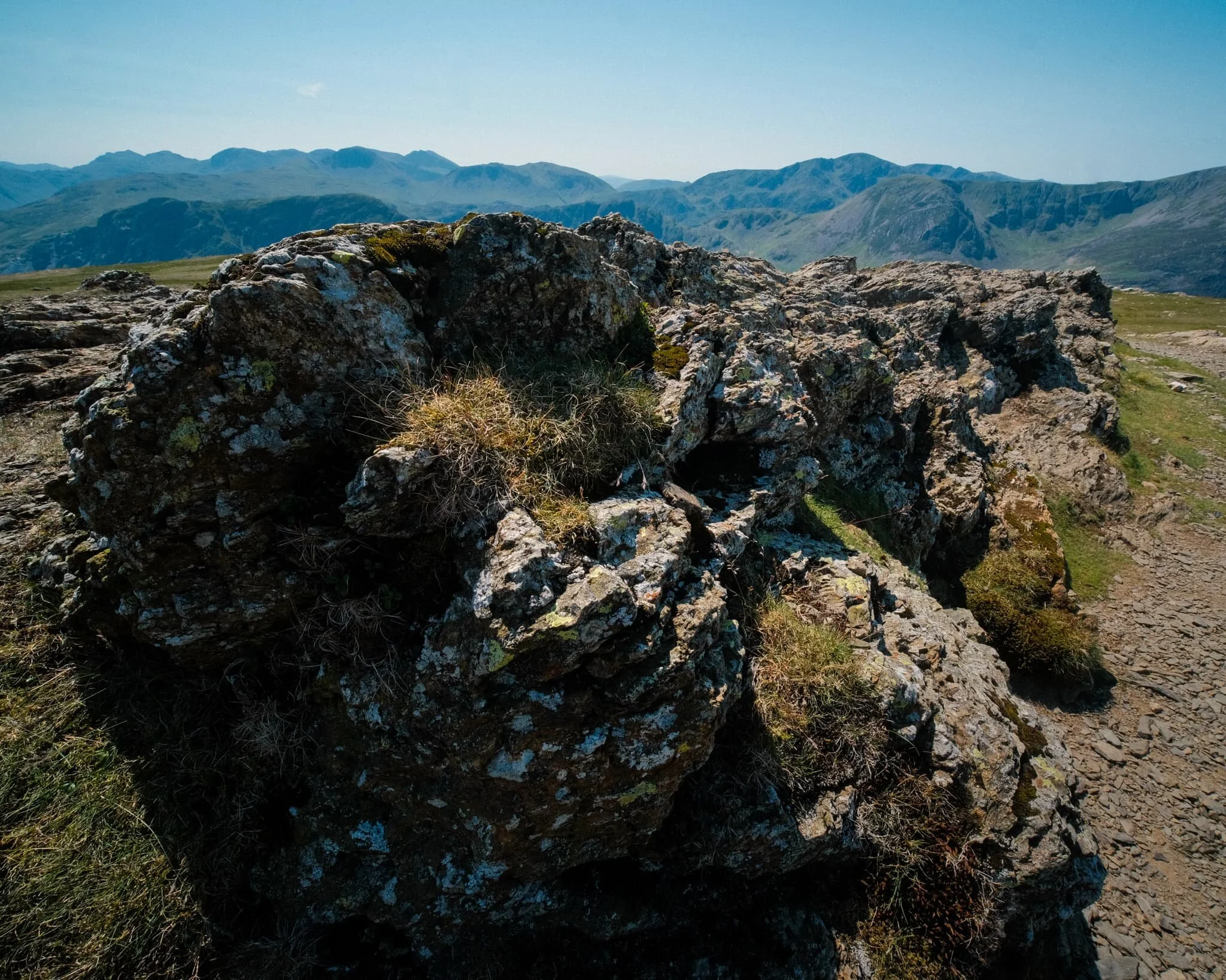  And the third and final summit! Robinson was definitely the hardest to climb. The top is relatively flat but its sides a rather steep, with paths made largely of loose scree. By the time we reached Robinson, it was midday and temperatures were really starting to climb. I went scurrying around the summit with my ultra-wide lens to shot some of the interesting rock formations. 
