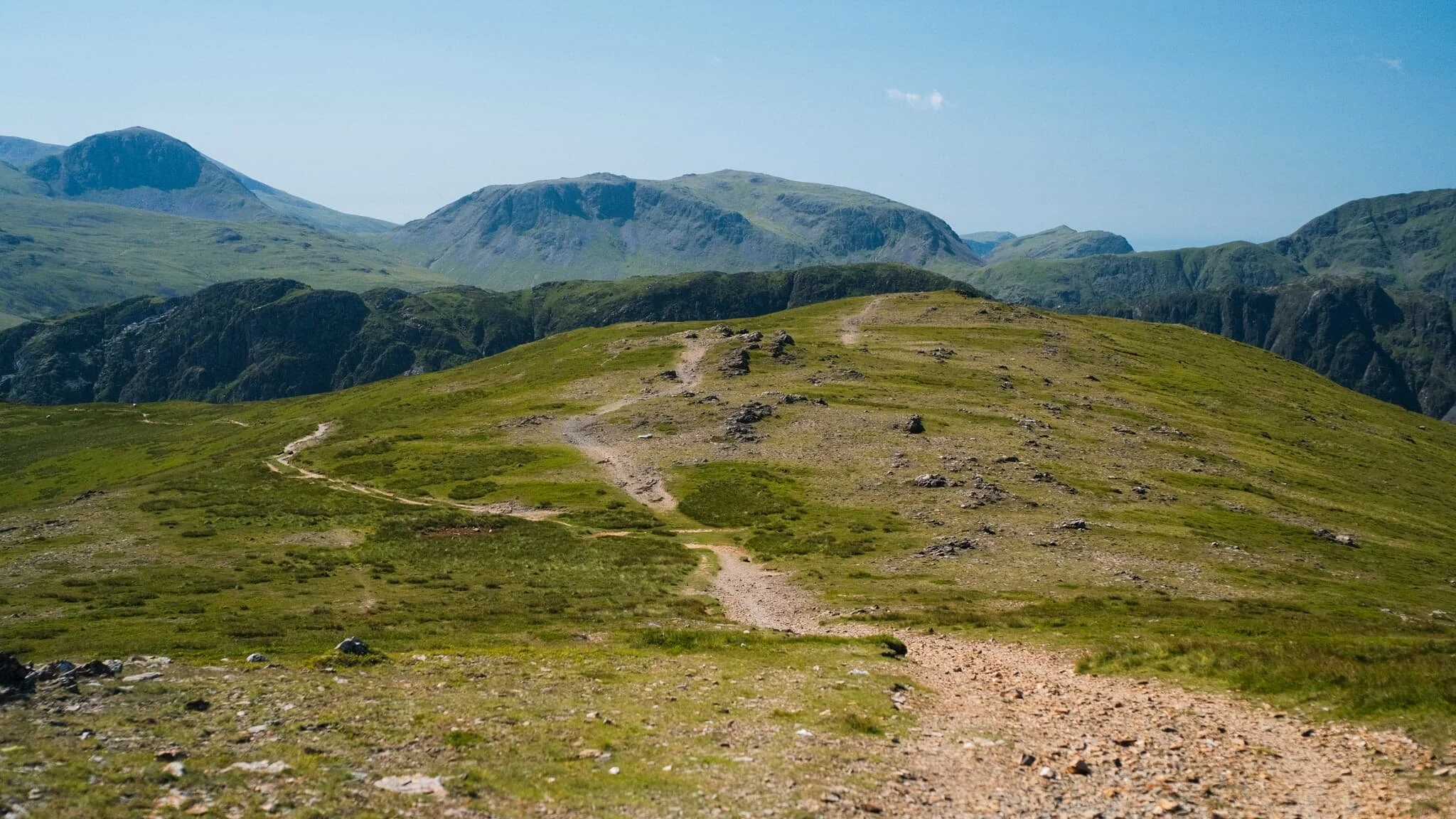  The way to the next fell, Robinson, involves returning back to the Hindscarth Edge trail and carrying onto the Littledale Edge trail towards Robinson. Before we did, I had to capture this panorama of fells from the Hindscarth summit. 