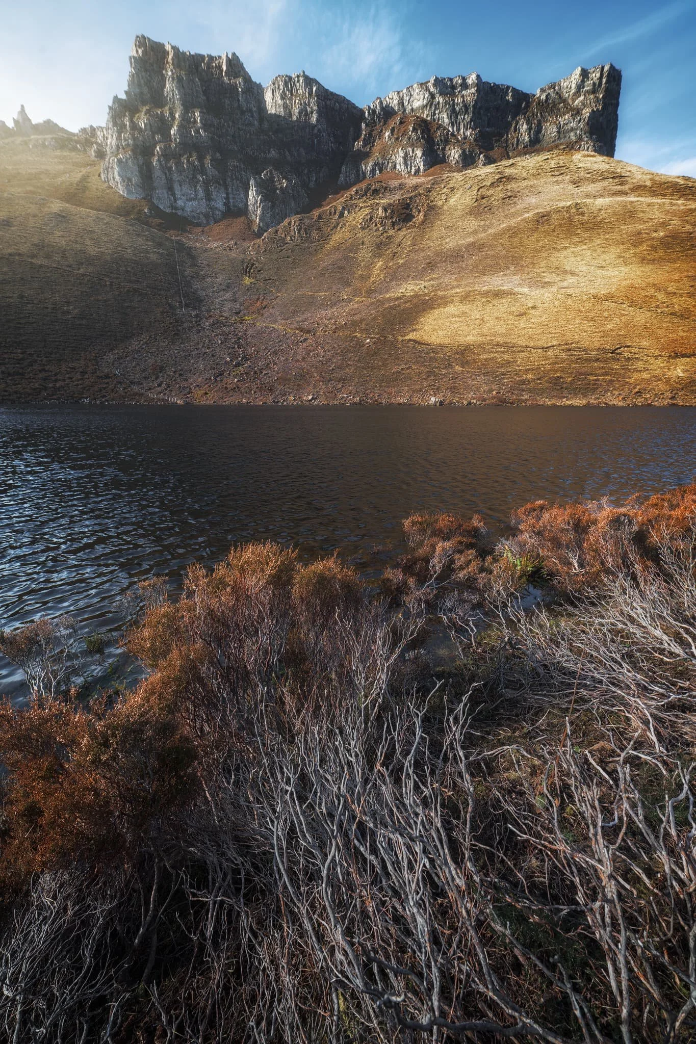  Beyond Loch Langaig, the trail starts to quickly ramp up and you soon arrive directly beneath the impressive Fingal&rsquo;s pinnacles. Below the pinnacles is Loch Hasco, which I cautiously clambered down to for this breathtaking composition.  