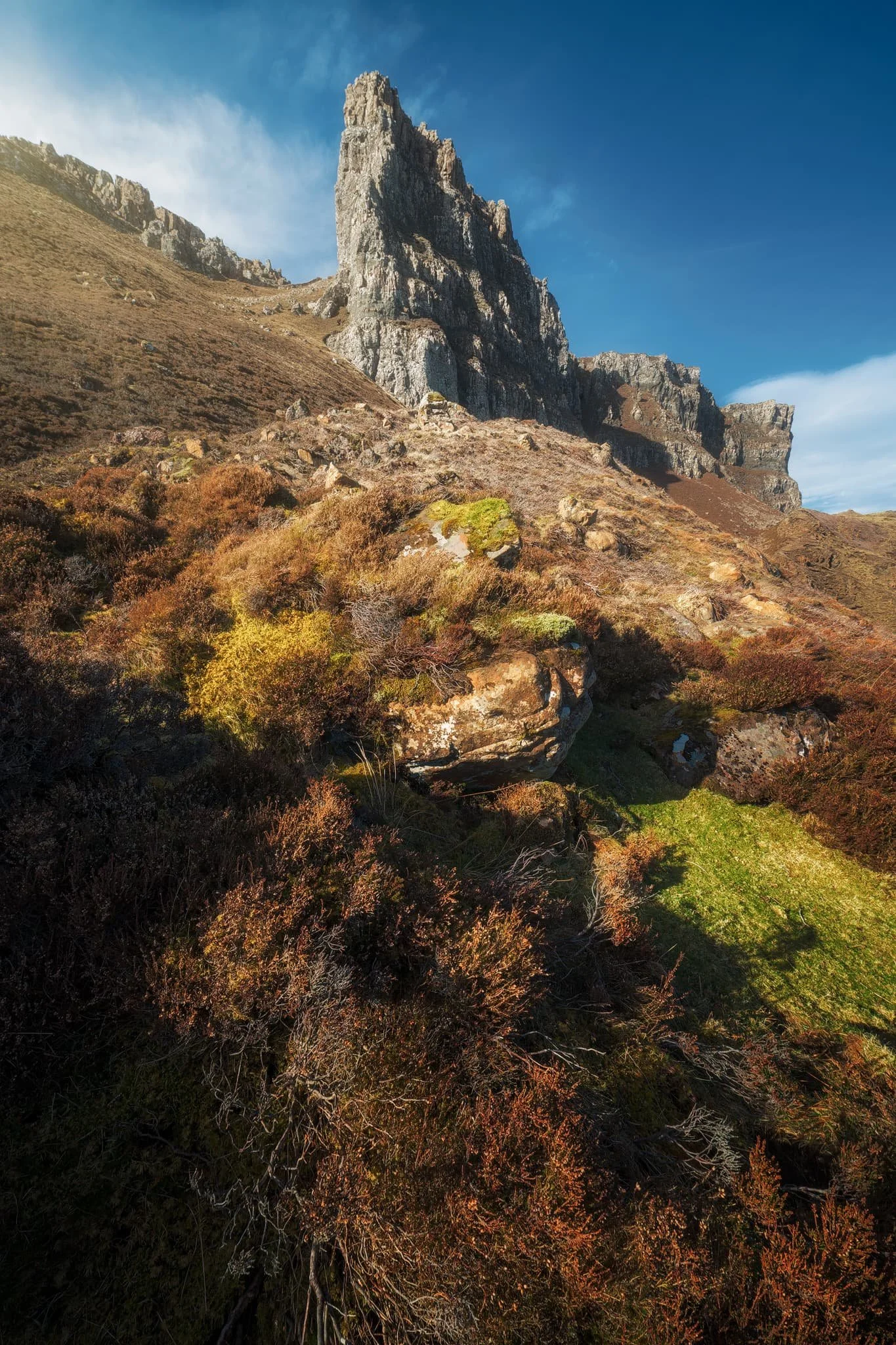  We returned to the trail as it began its steep pull towards the cliffs of  Meall na Suiramach , the highest peak of the Quiraing. From the side, the Pinnacles reveal a more slender profile that I couldn&rsquo;t ignore. 