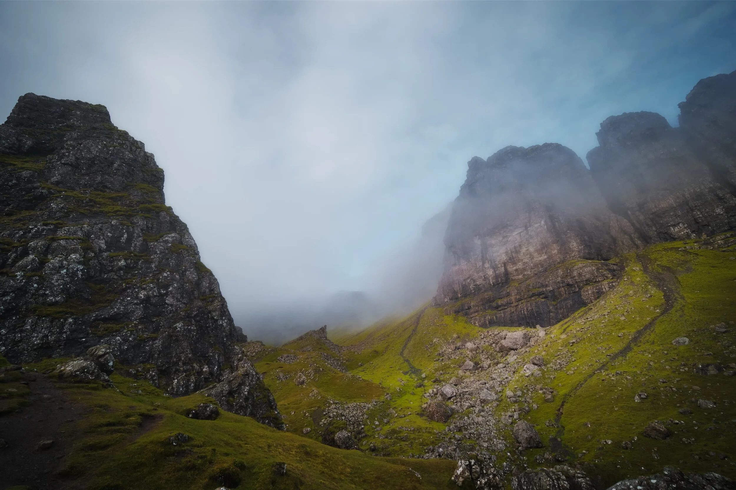  Tendrils of fog and mist gently caressed the cliffs of the Storr and burned off just as quickly. 
