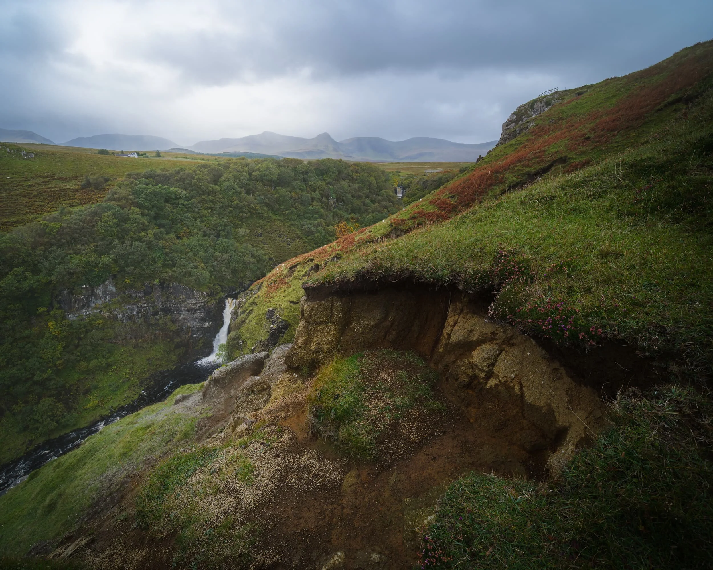  And now a much wider composition, which manages to capture both of the Lealt Falls with the Trotternish landslip and  Sgùrr a&rsquo; Mhadaidh Ruaidh  in the distance. A squall was also closing in on the peaks and started to obscure them. 