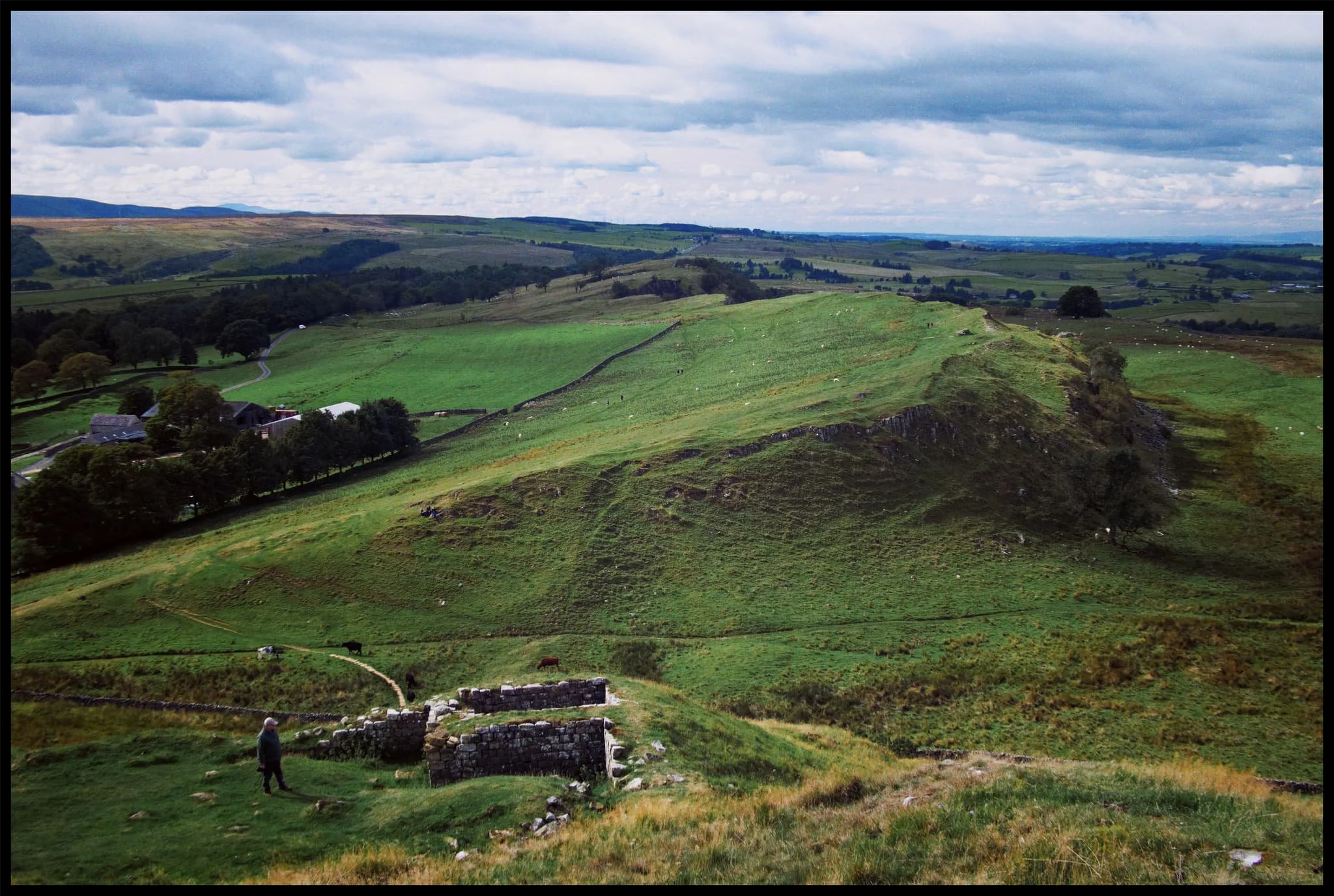  My Dad below, taking in the history of the area, as I clamber up the crag to soak in the extensive views. 