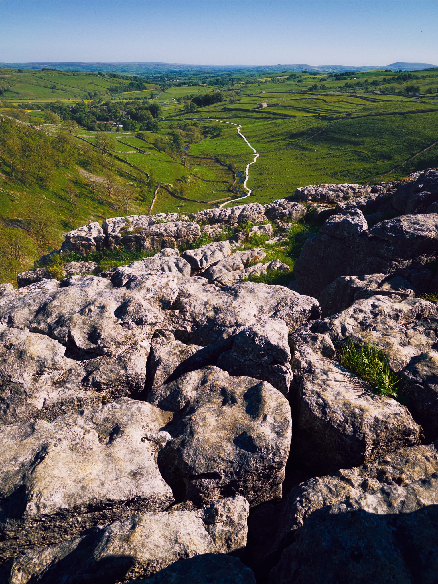 Finally we arrive at the top of Malham Cove and its expansive limestone pavement. Here, the prehistoric water racing from Watlowes would’ve dropped down Malham Cove in what surely would’ve been one of Europe’s biggest waterfalls: 80 m (260 ft) high and more than 300 m (980 ft) wide.