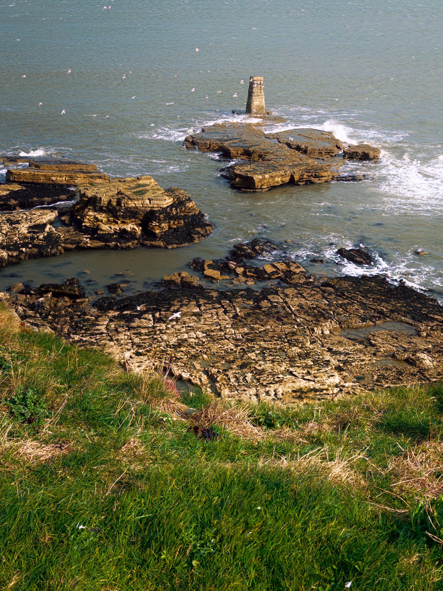 At Lizard Point just before the squall soaked us, I spied this unusually regular formation out into the sea. I can&rsquo;t see any mention of it on the maps. I couldn&rsquo;t decide if it was natural and amazingly regular, or human-made and weathered down. Still, made a composition of it.